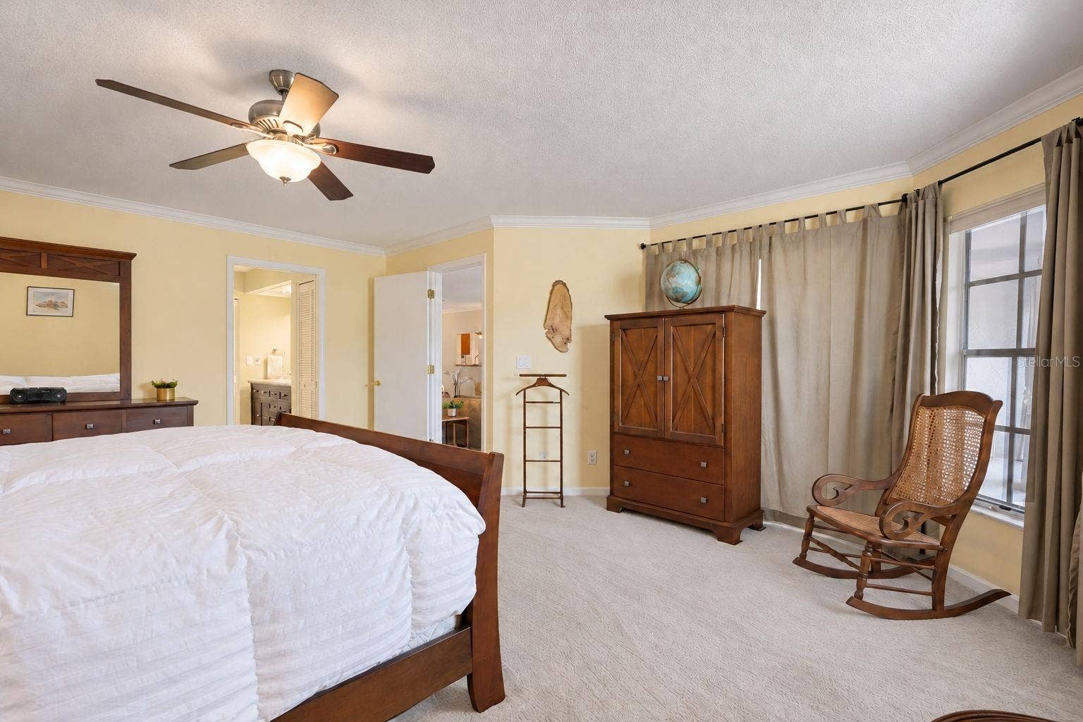 1146 RUSTLEWOOD COURT, Palm Harbor, FL 34684 Primary hall leads to his & hers walk-in closets and updated en-suite~