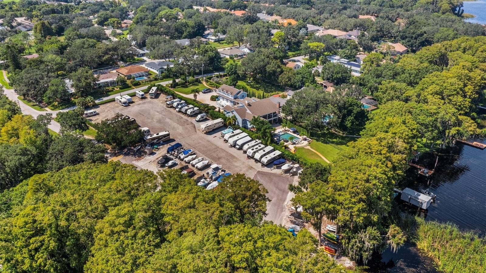 1146 RUSTLEWOOD COURT, Palm Harbor, FL 34684 Amenities included free RV or boat storage in a secure lot with a boat ramp~