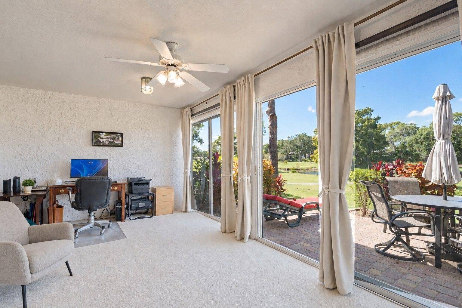 1146 RUSTLEWOOD COURT, Palm Harbor, FL 34684 Heated & cooled Florida room with endless possibilities & endless golf views~