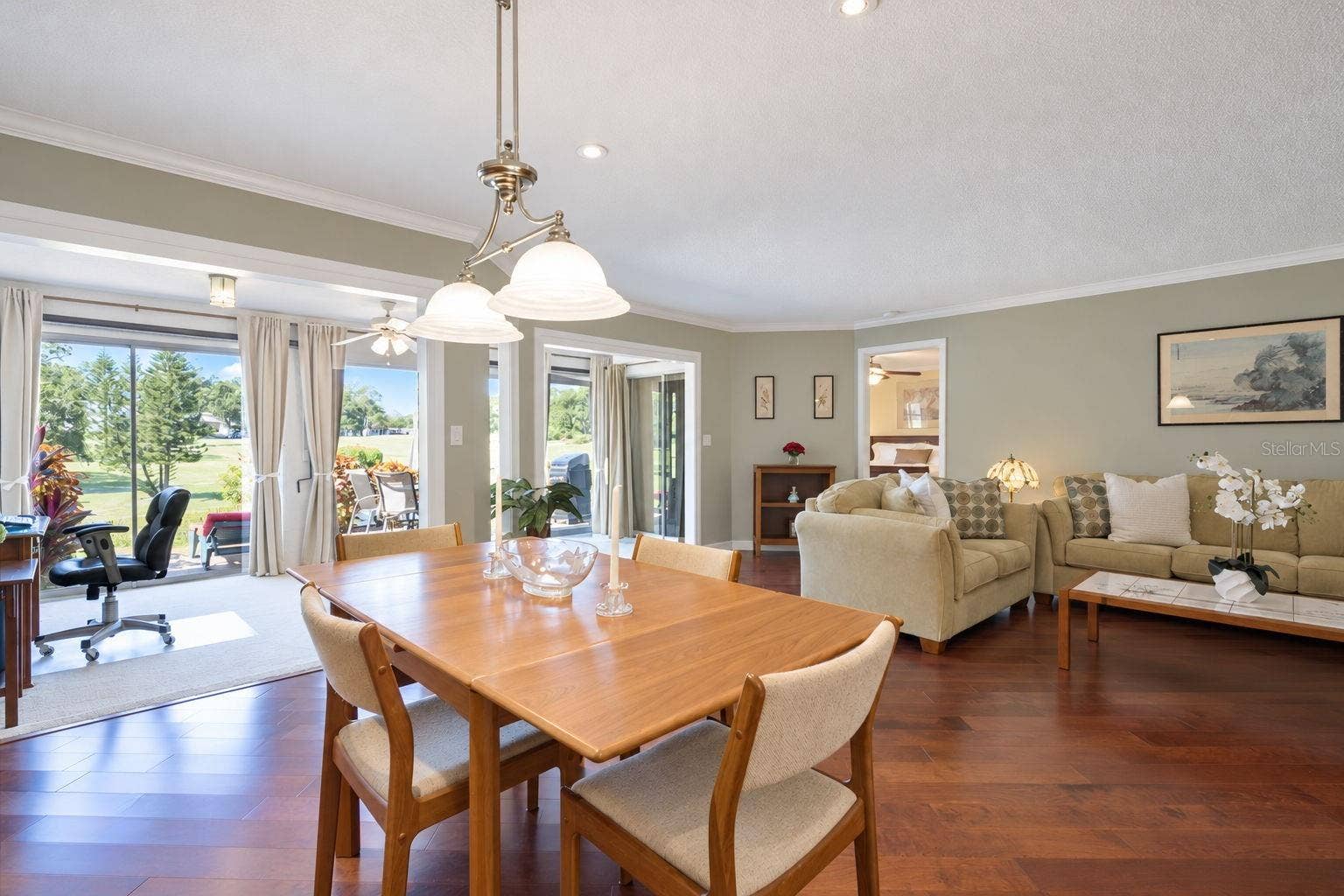 1146 RUSTLEWOOD COURT, Palm Harbor, FL 34684 Natural light floods the space through the massive glass slider & windows~