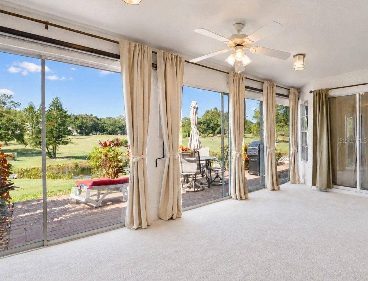 1146 RUSTLEWOOD COURT, Palm Harbor, FL 34684 Massive glass slider that leads to your paver patio for year-round enjoyment~