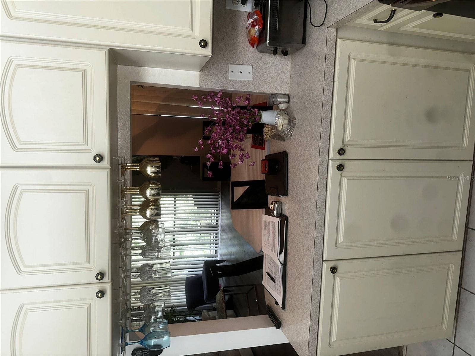2600 PINE RIDGE WAY S, #B2, Palm Harbor, FL 34684 View from kitchen into the dining room/ living room
