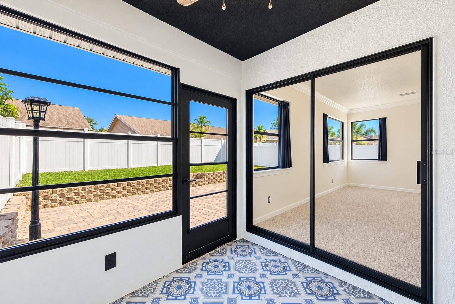 3277 HIBISCUS DRIVE, Palm Harbor, FL 34684 Enclosed patio.