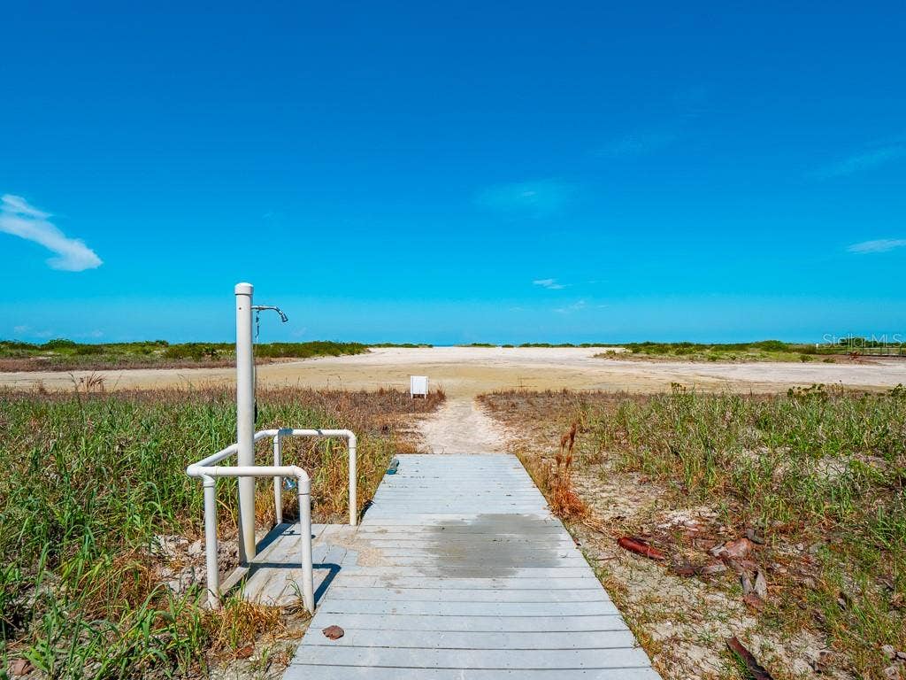 1270 GULF BOULEVARD, #603, Clearwater, FL 33767 Out door shower and walkway to beach