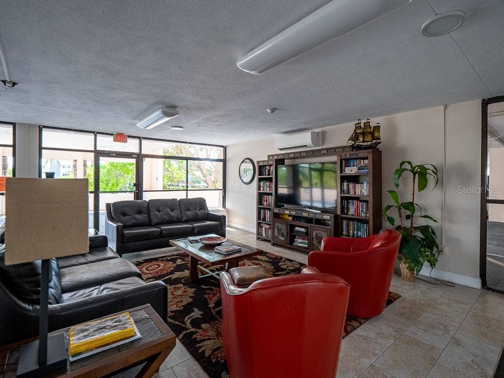 1270 GULF BOULEVARD, #603, Clearwater, FL 33767 Lobby Lounge Area with large TV