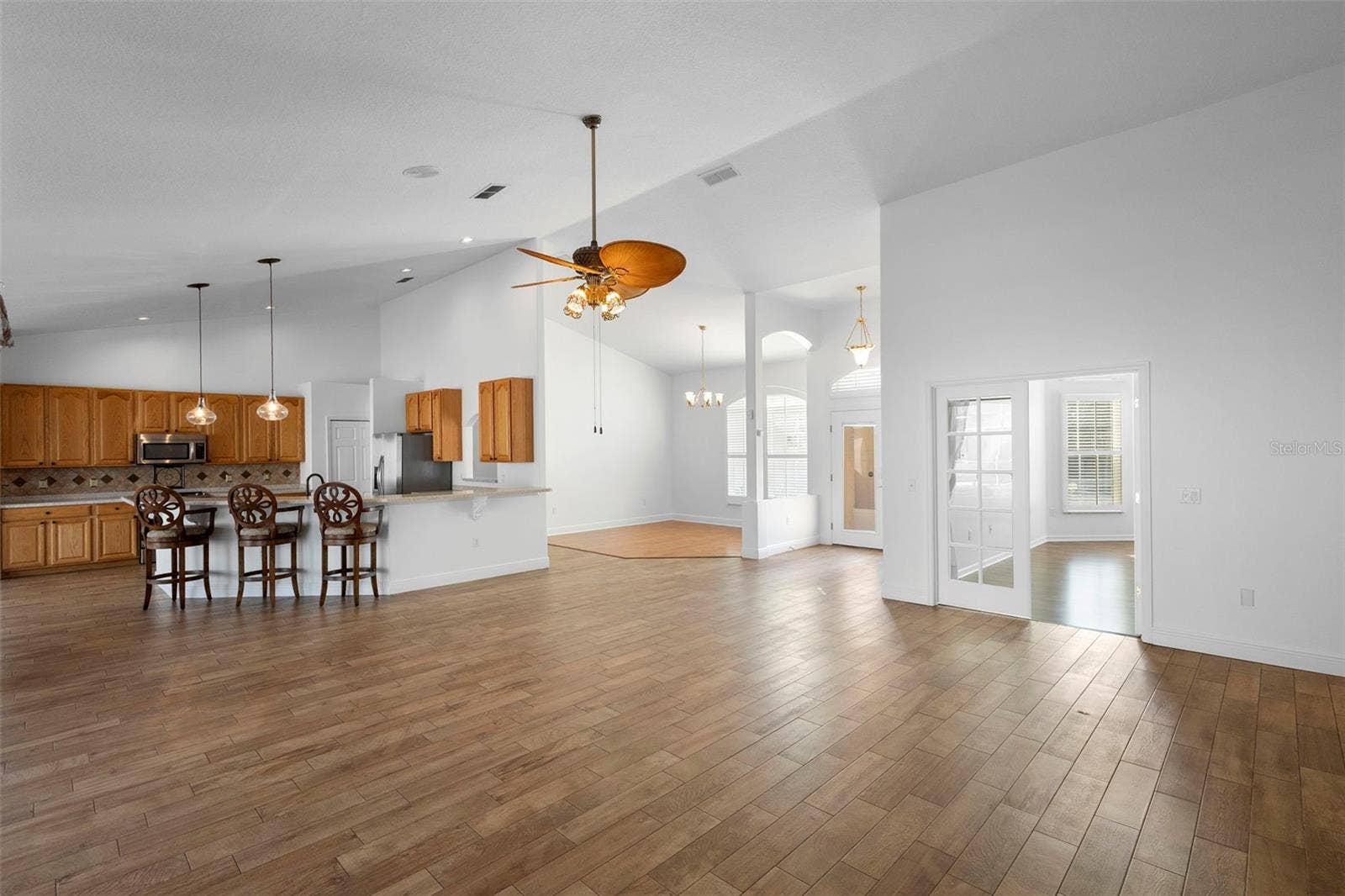 73 SANCTUARY AVENUE, Debary, FL 32713 LIVING ROOM W/KITCHEN VIEW