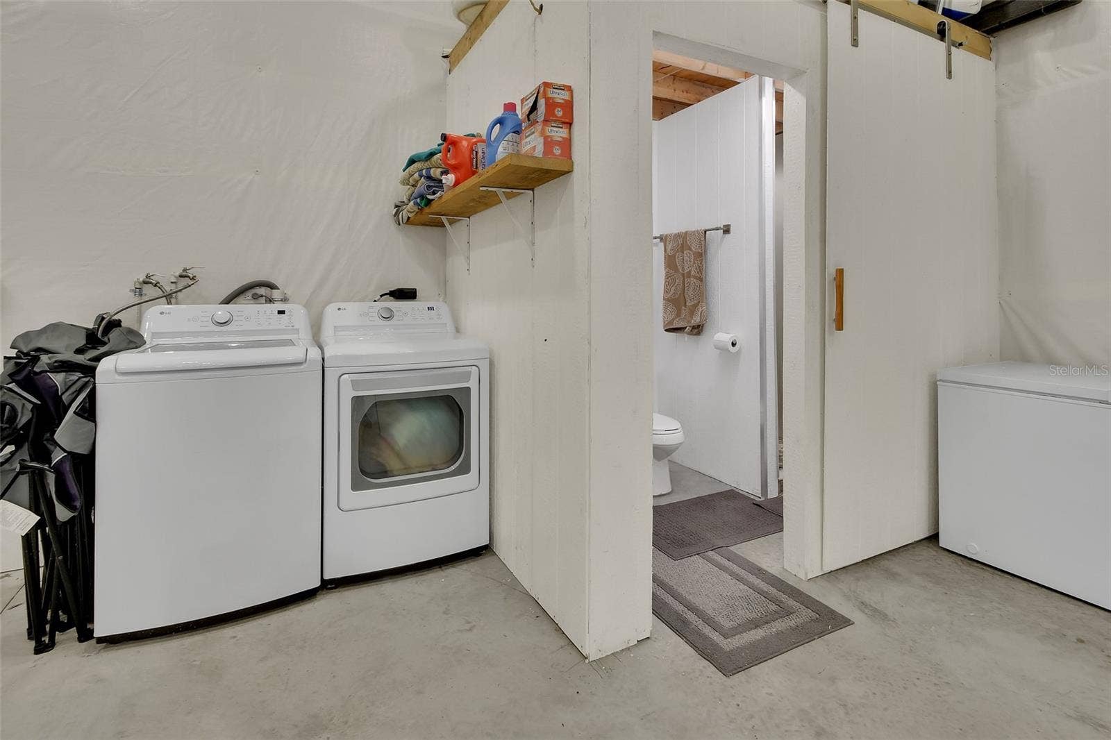 4611 GRAND AVENUE, De Leon Springs, FL 32130 Laundry area inside outbuilding