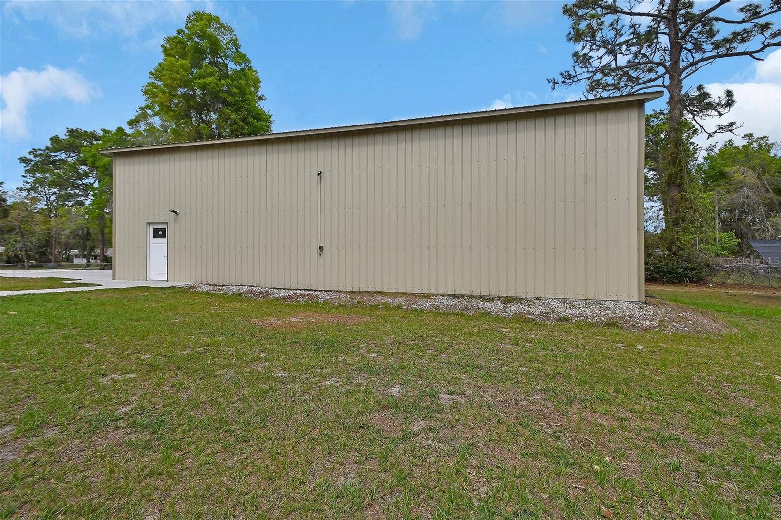 4611 GRAND AVENUE, De Leon Springs, FL 32130 side of outbuilding