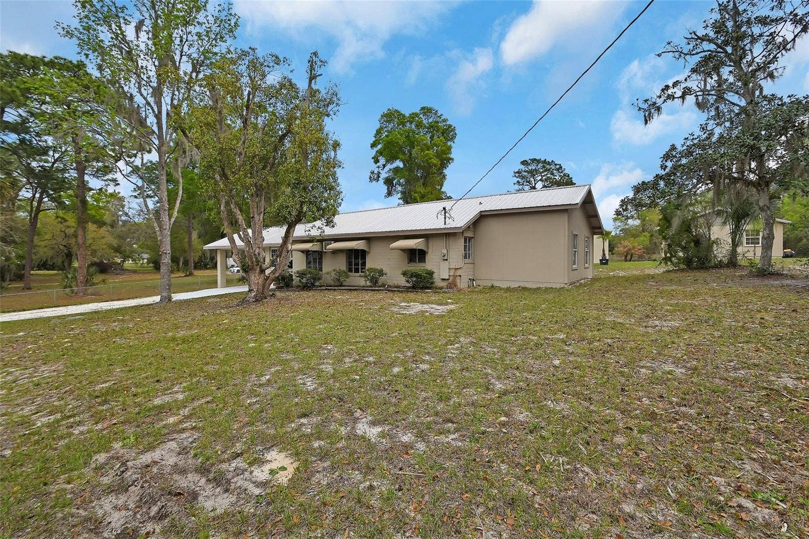 4611 GRAND AVENUE, De Leon Springs, FL 32130 Home #1 Side Shot