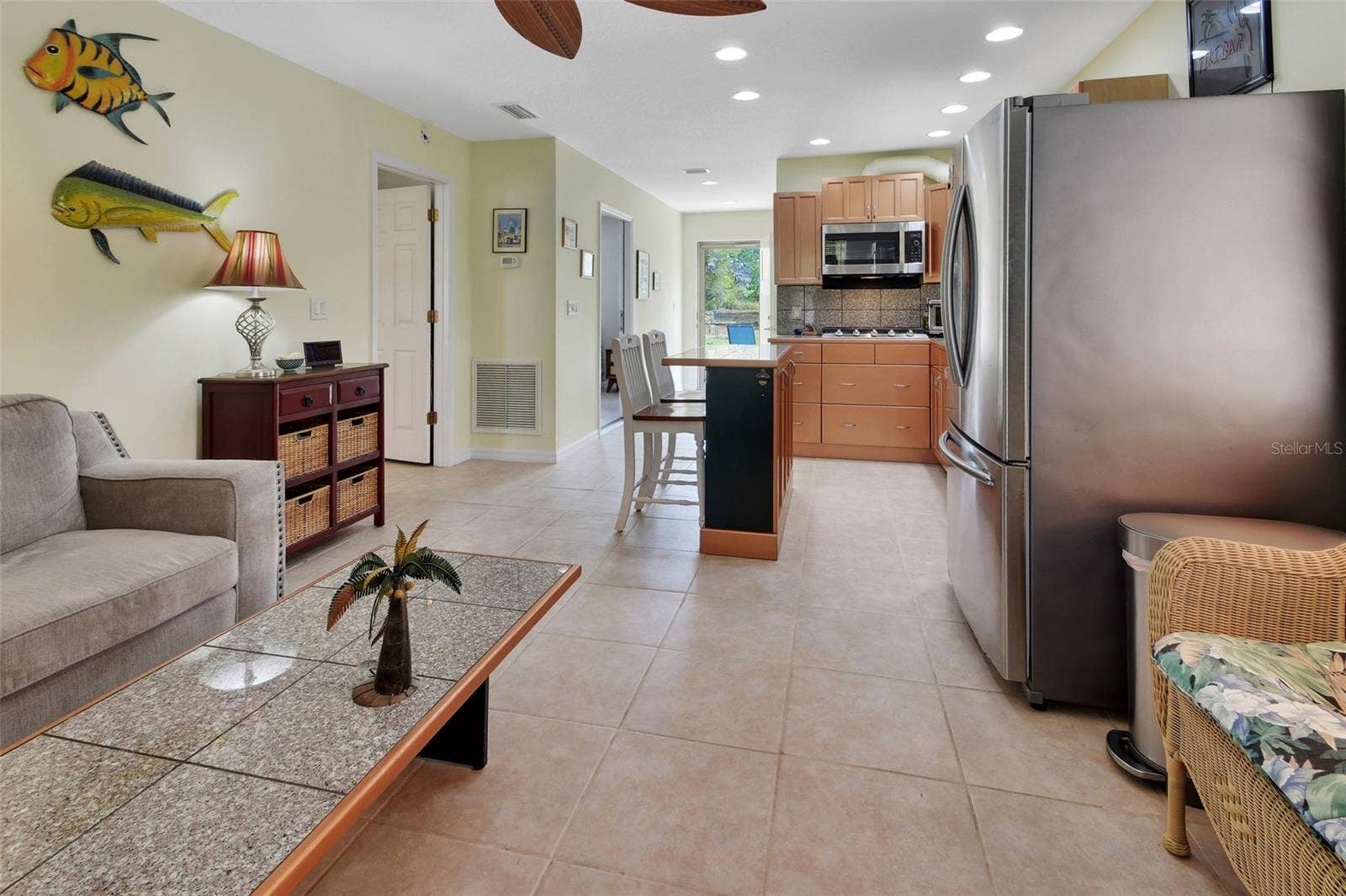 4611 GRAND AVENUE, De Leon Springs, FL 32130 Home #2 shot of LR,Kitchen and dining area at Breakfast bar