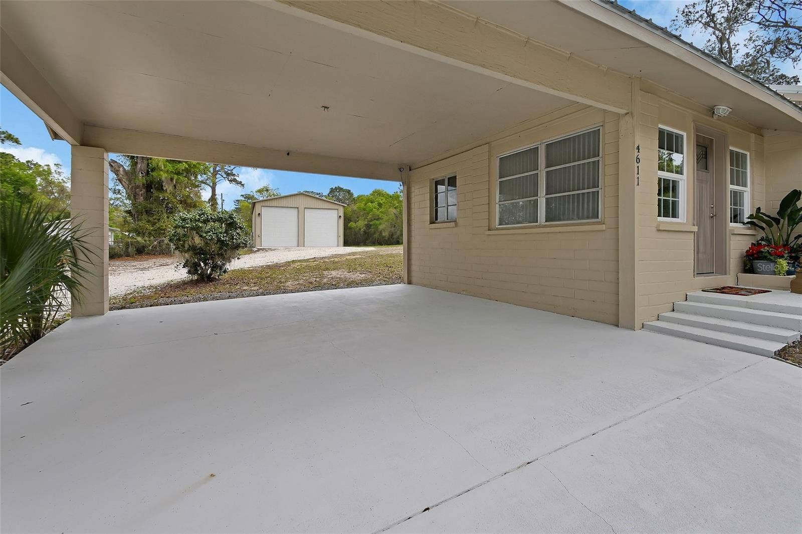 4611 GRAND AVENUE, De Leon Springs, FL 32130 Home #1 Carport freshly painted