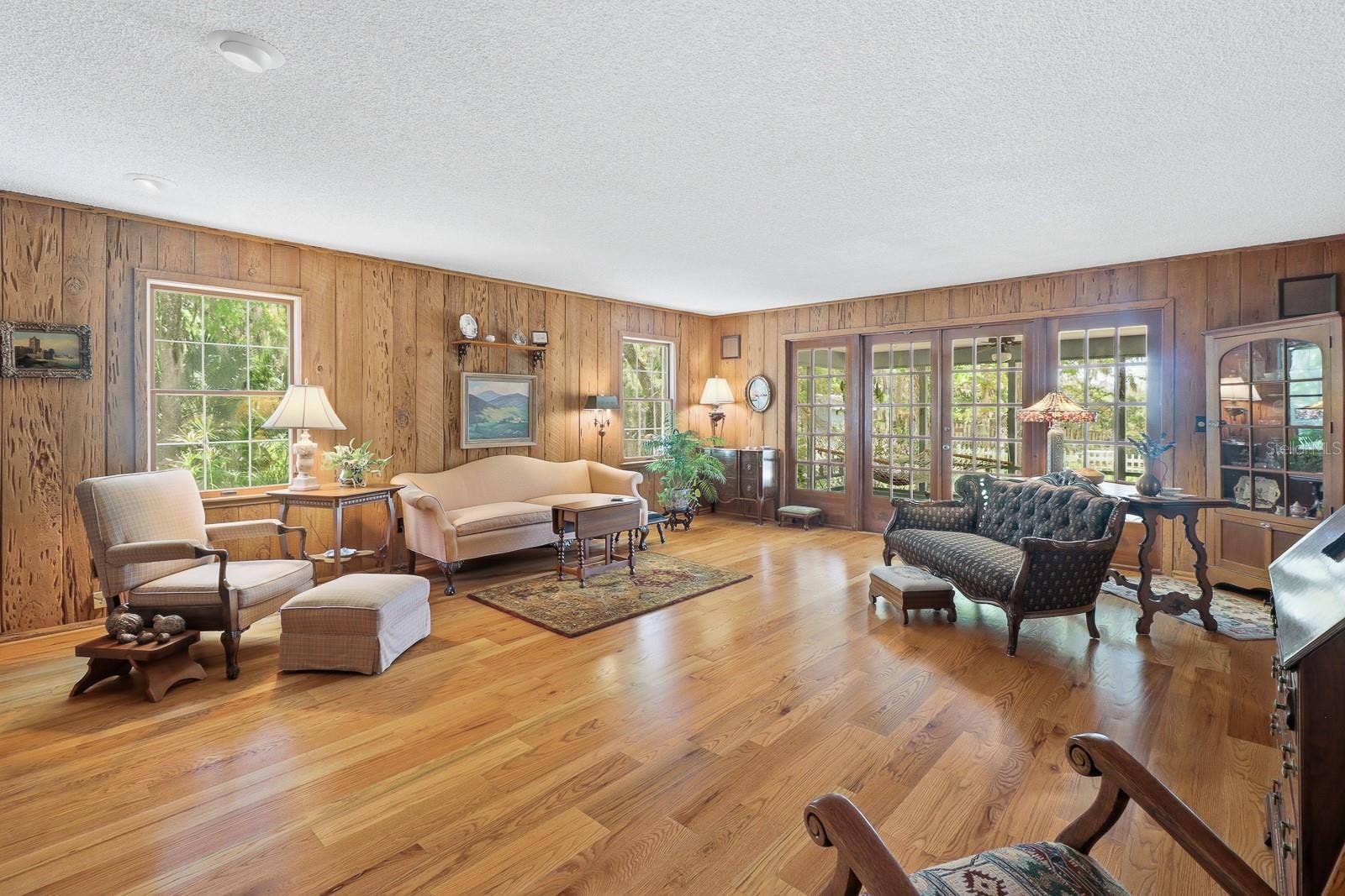 6491 SPRUCE CREEK ROAD, Port Orange, FL 32127 Wood floors with French doors leading to the back porch.
