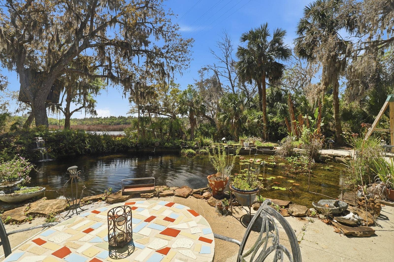 6491 SPRUCE CREEK ROAD, Port Orange, FL 32127 Koi pond with fountain