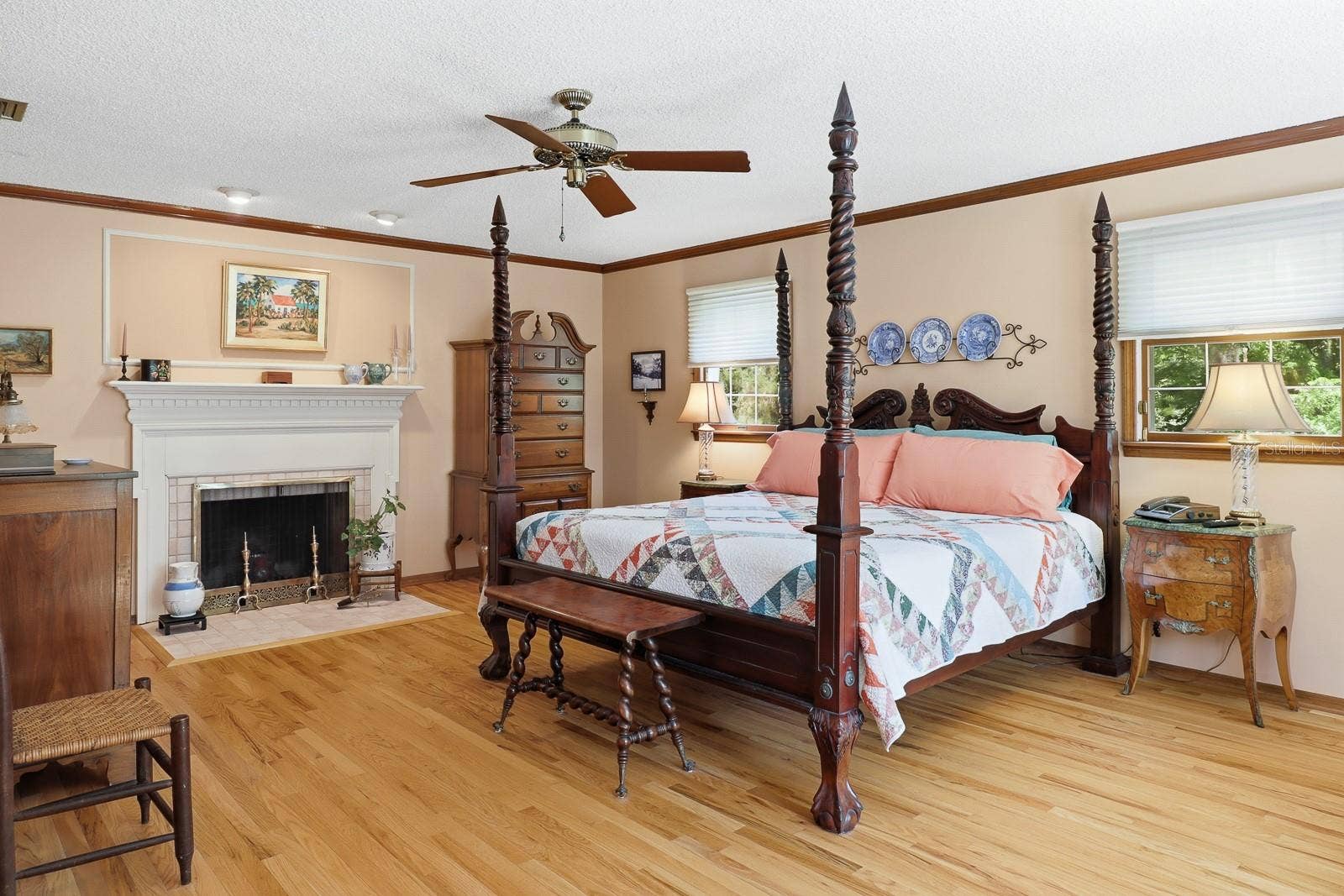 6491 SPRUCE CREEK ROAD, Port Orange, FL 32127 Primary bedroom with wood burning fireplace.