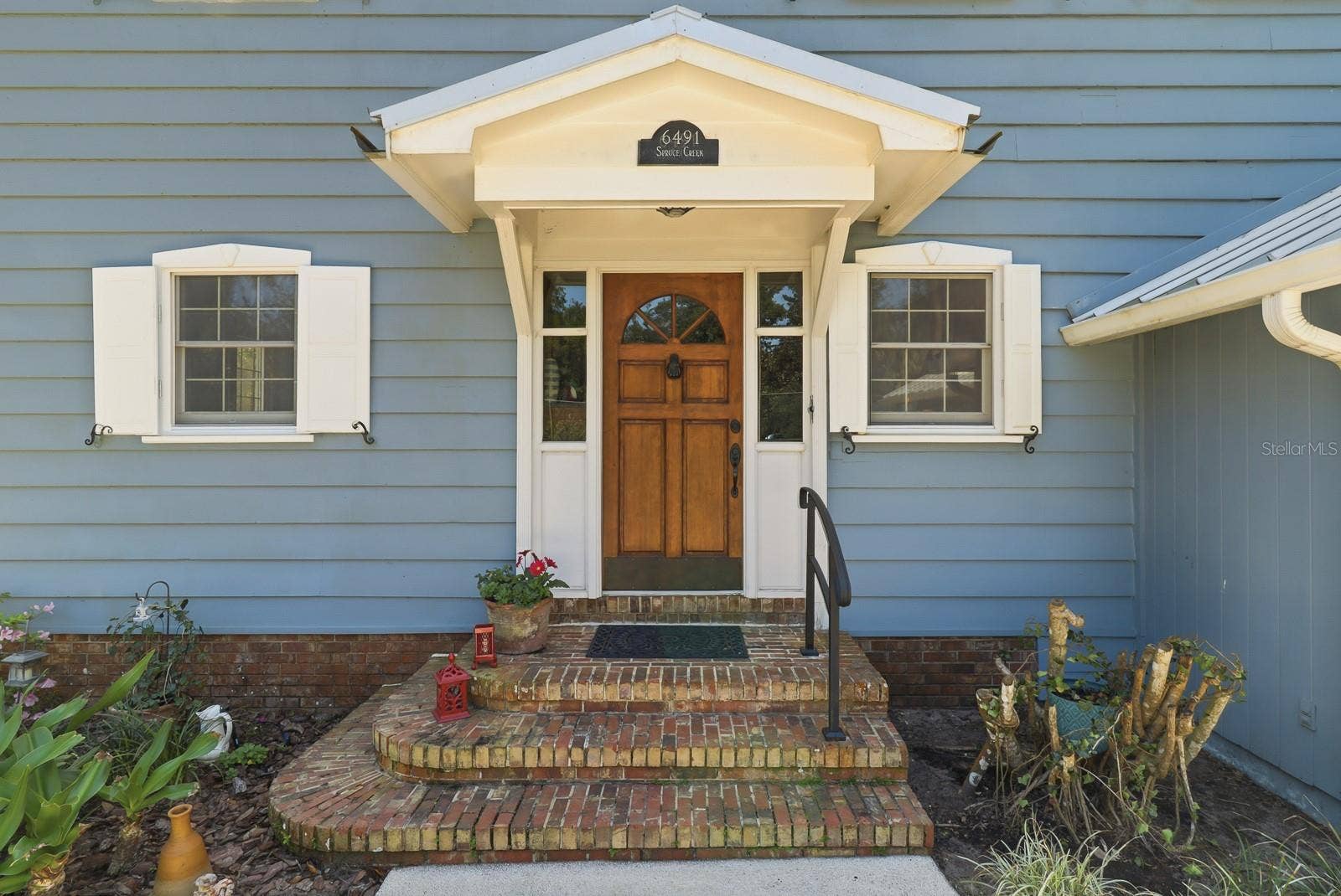 6491 SPRUCE CREEK ROAD, Port Orange, FL 32127 Welcoming front entrance