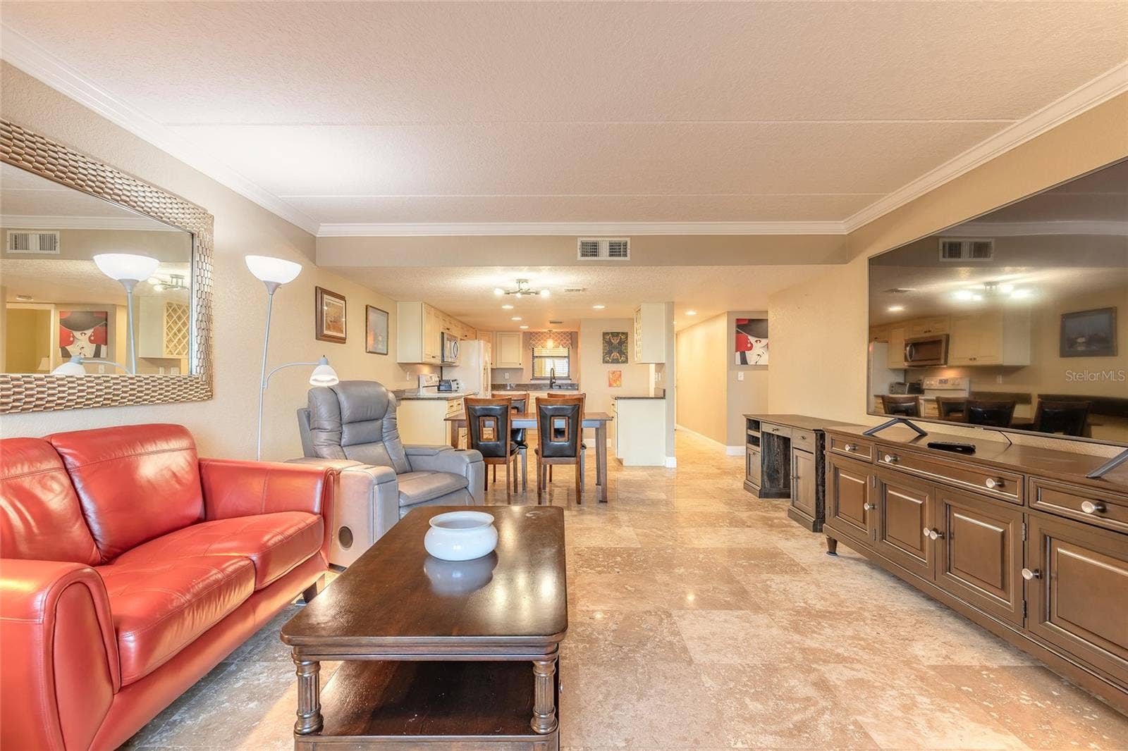 3131 S RIDGEWOOD AVENUE, #101, South Daytona, FL 32119 Living to Dining and Kitchen