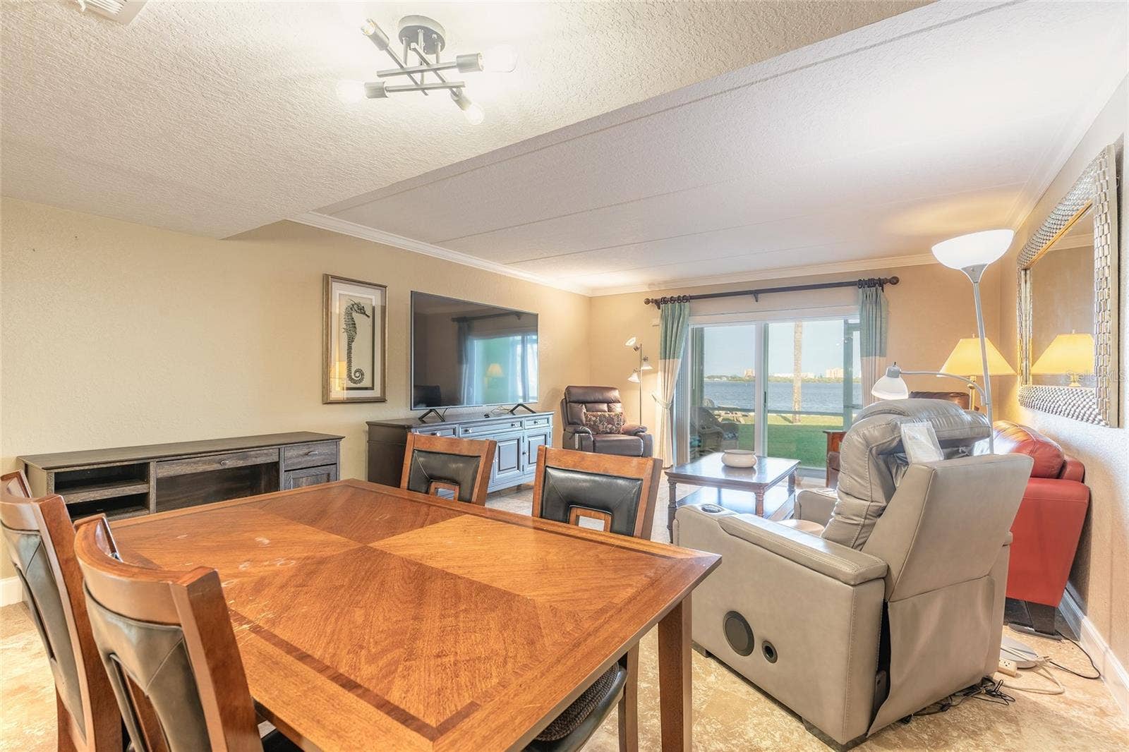 3131 S RIDGEWOOD AVENUE, #101, South Daytona, FL 32119 Dining to Living Room