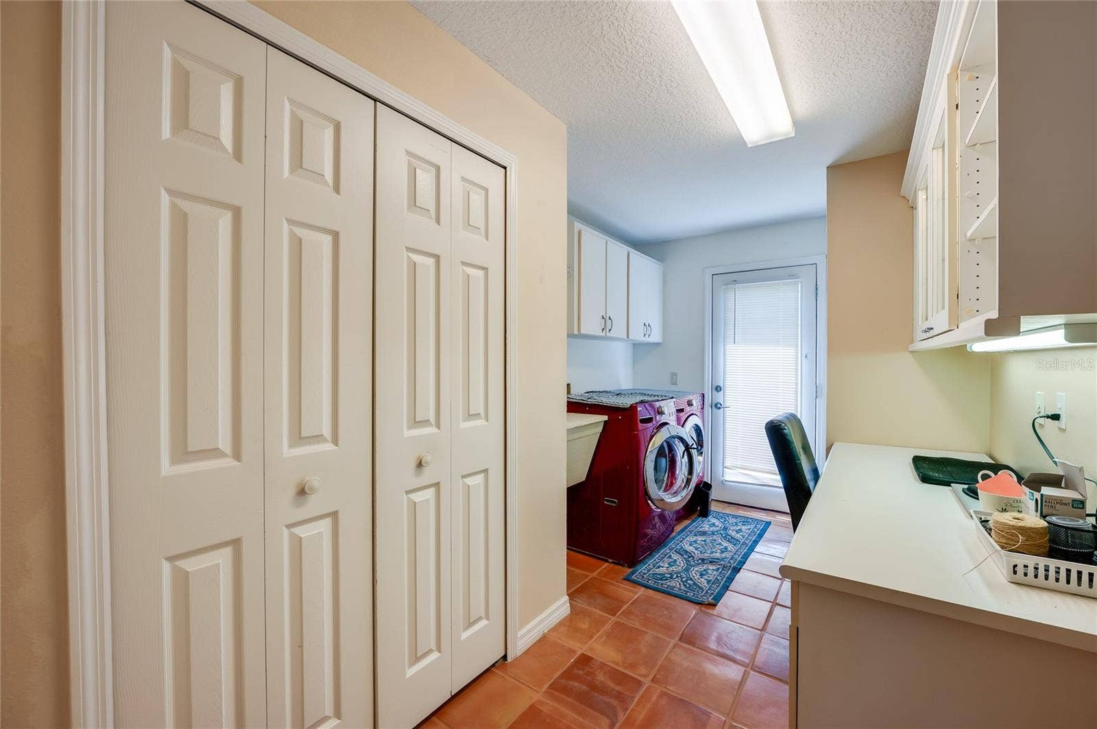1312 N WEMBLEY CIRCLE, Port Orange, FL 32128 Large laundry room with laundry sink and desk area