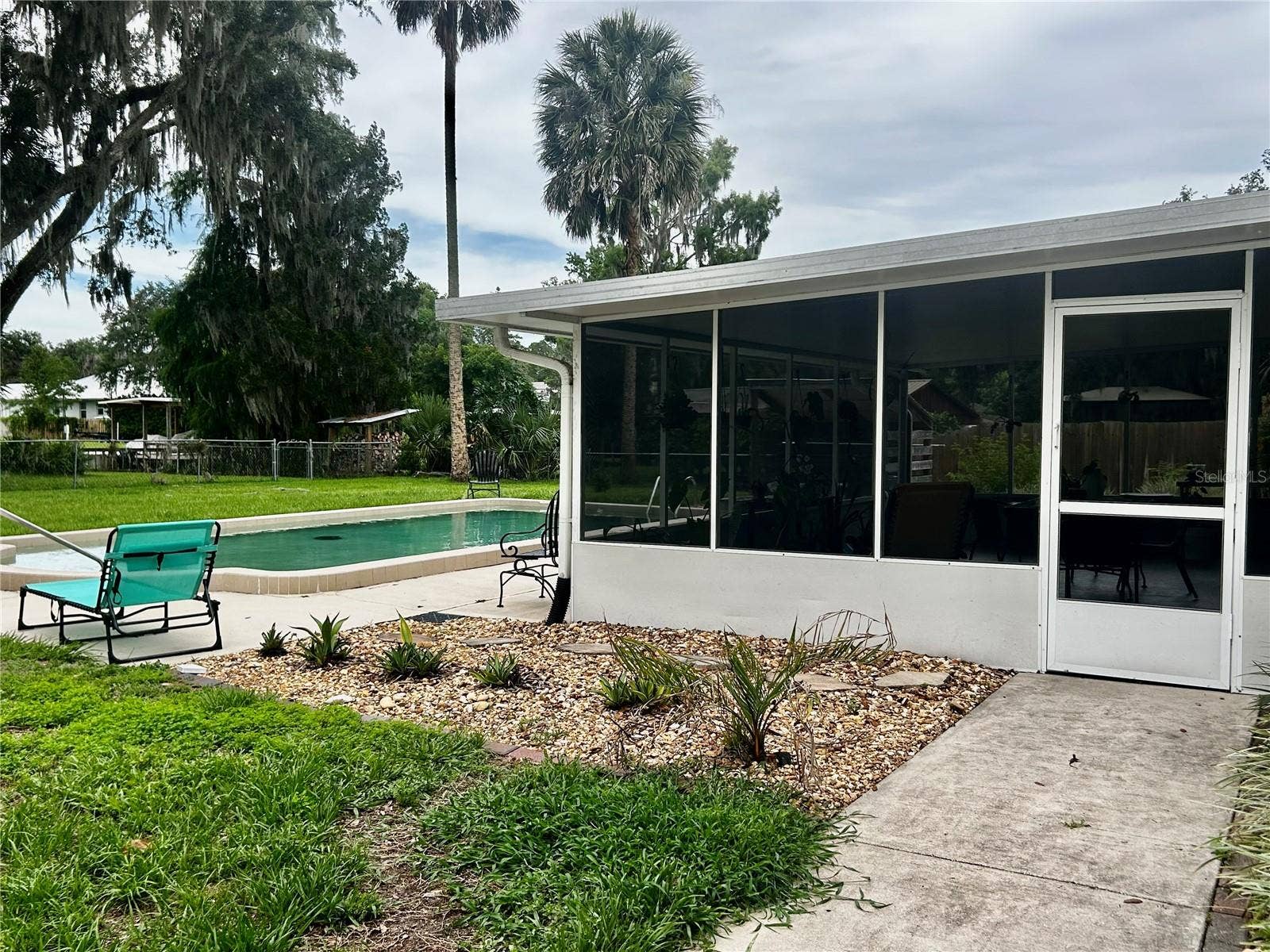 2950 N SHELL ROAD, Deland, FL 32720 side gates on both side of the house for easy entry to pool or add'l parking