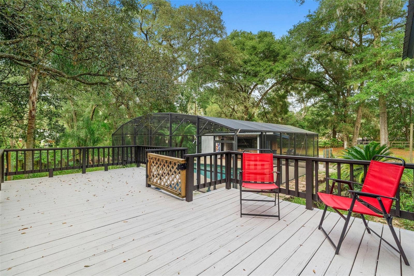 1268 MCGREGOR ROAD, Deland, FL 32720 Exterior rear patio leading to pool