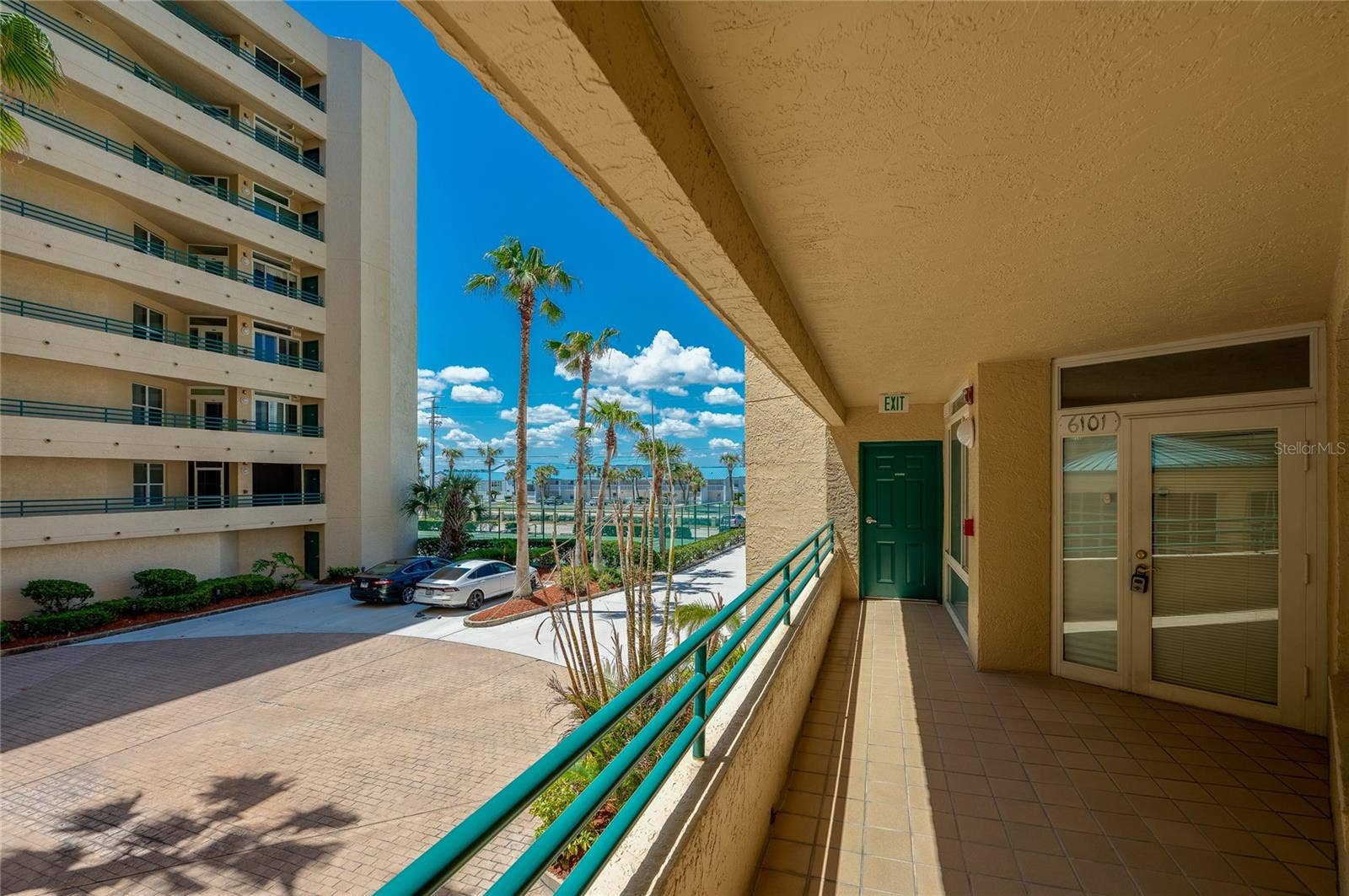 4575 S ATLANTIC AVENUE, #6101, Port Orange, FL 32127 Covered exterior walkway provides convenient access to the unit, with views of the surrounding grounds and nearby amenities.