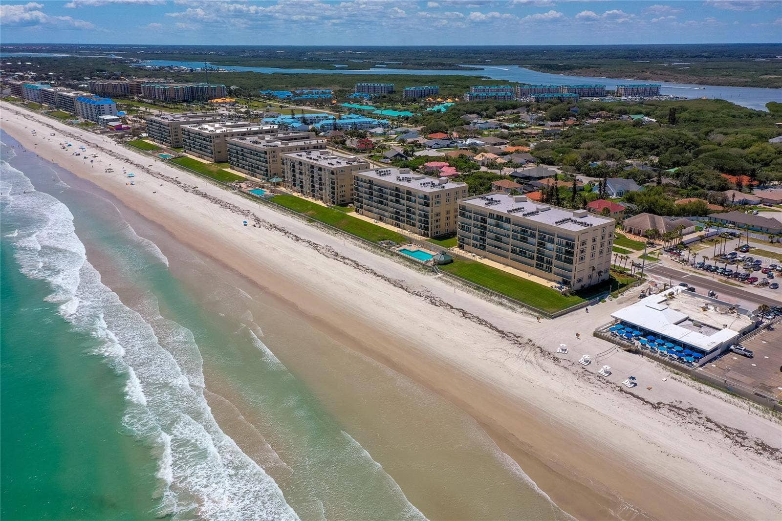 4575 S ATLANTIC AVENUE, #6101, Port Orange, FL 32127 Sweeping angle of the shoreline highlighting miles of sandy beach and the propertys oceanfront setting.