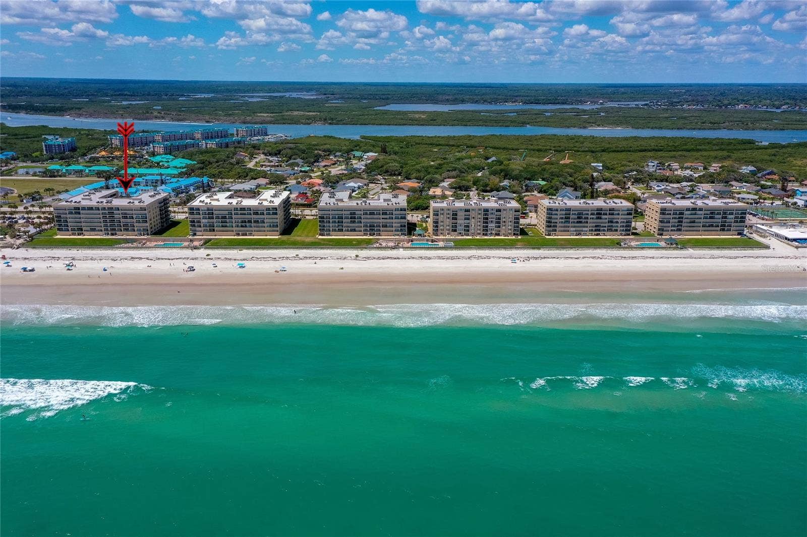 4575 S ATLANTIC AVENUE, #6101, Port Orange, FL 32127 Stunning overhead view emphasizing the buildings direct beachfront location with expansive ocean vistas.