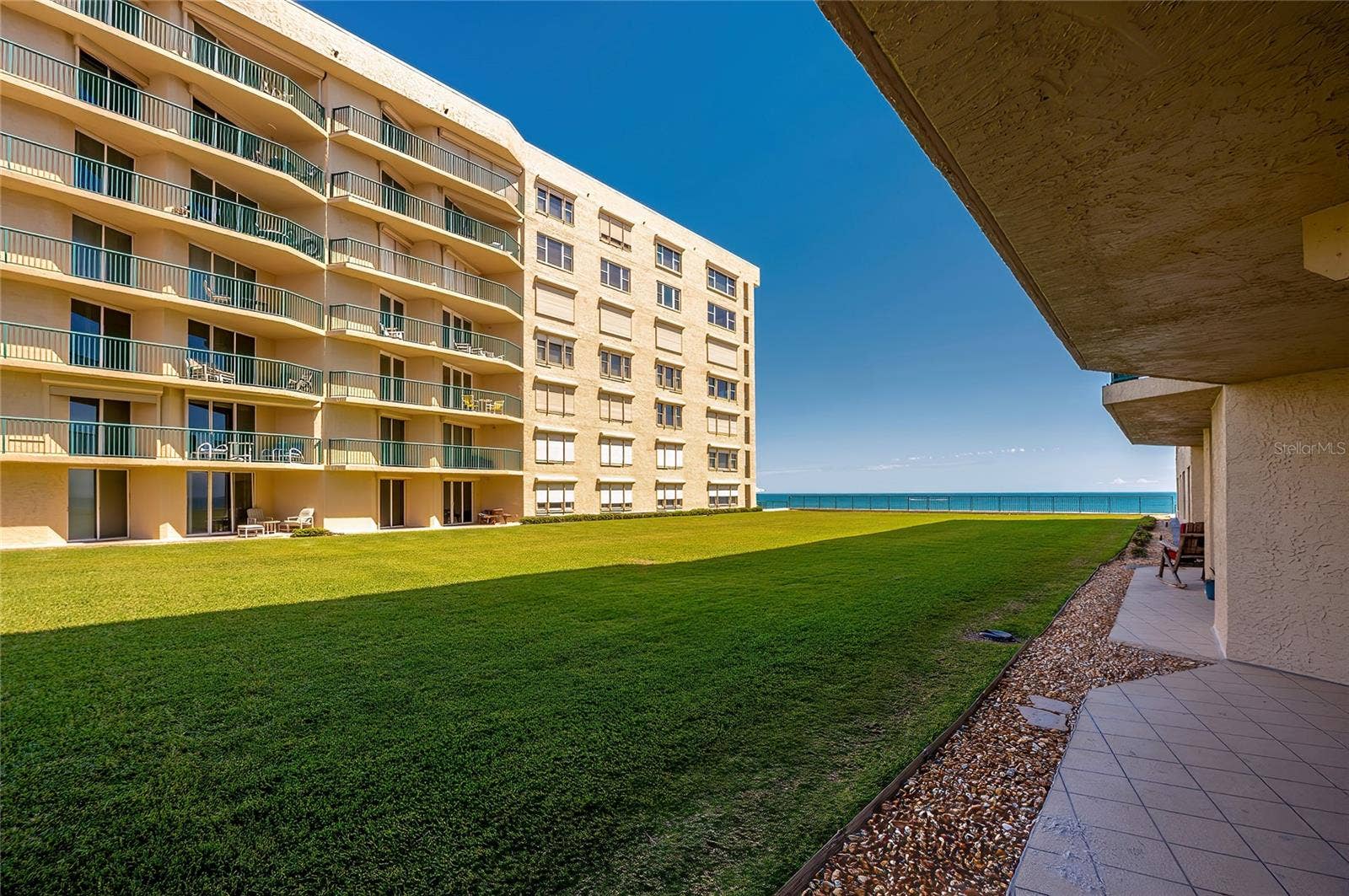 4575 S ATLANTIC AVENUE, #6101, Port Orange, FL 32127 Expansive green space leads toward the ocean, offering a serene setting with open views and coastal ambiance.