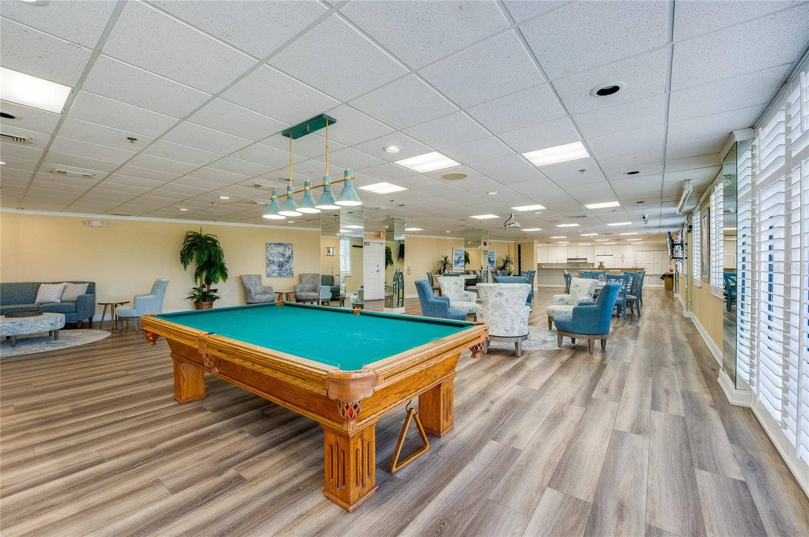 4575 S ATLANTIC AVENUE, #6101, Port Orange, FL 32127 Spacious amenity room featuring a pool table, multiple seating areas, and flexible entertainment space.