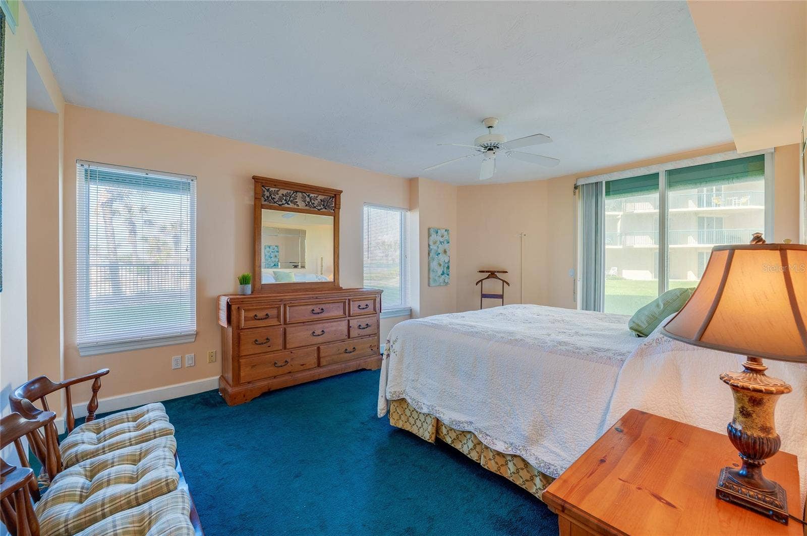 4575 S ATLANTIC AVENUE, #6101, Port Orange, FL 32127 A generously sized primary suite with large windows, soft natural light, and ample space for furnishings, creating a peaceful retreat.