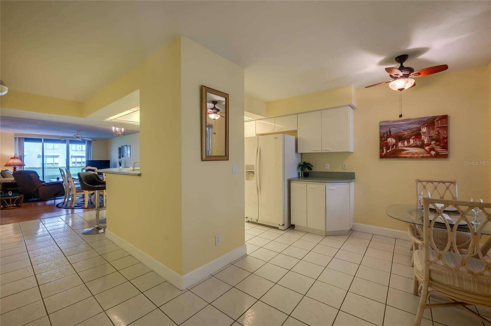 4575 S ATLANTIC AVENUE, #6101, Port Orange, FL 32127 This open-concept kitchen flows effortlessly into the dining space, featuring ample cabinetry, generous counter space, and a functional layout perfect for everyday living and entertaining.