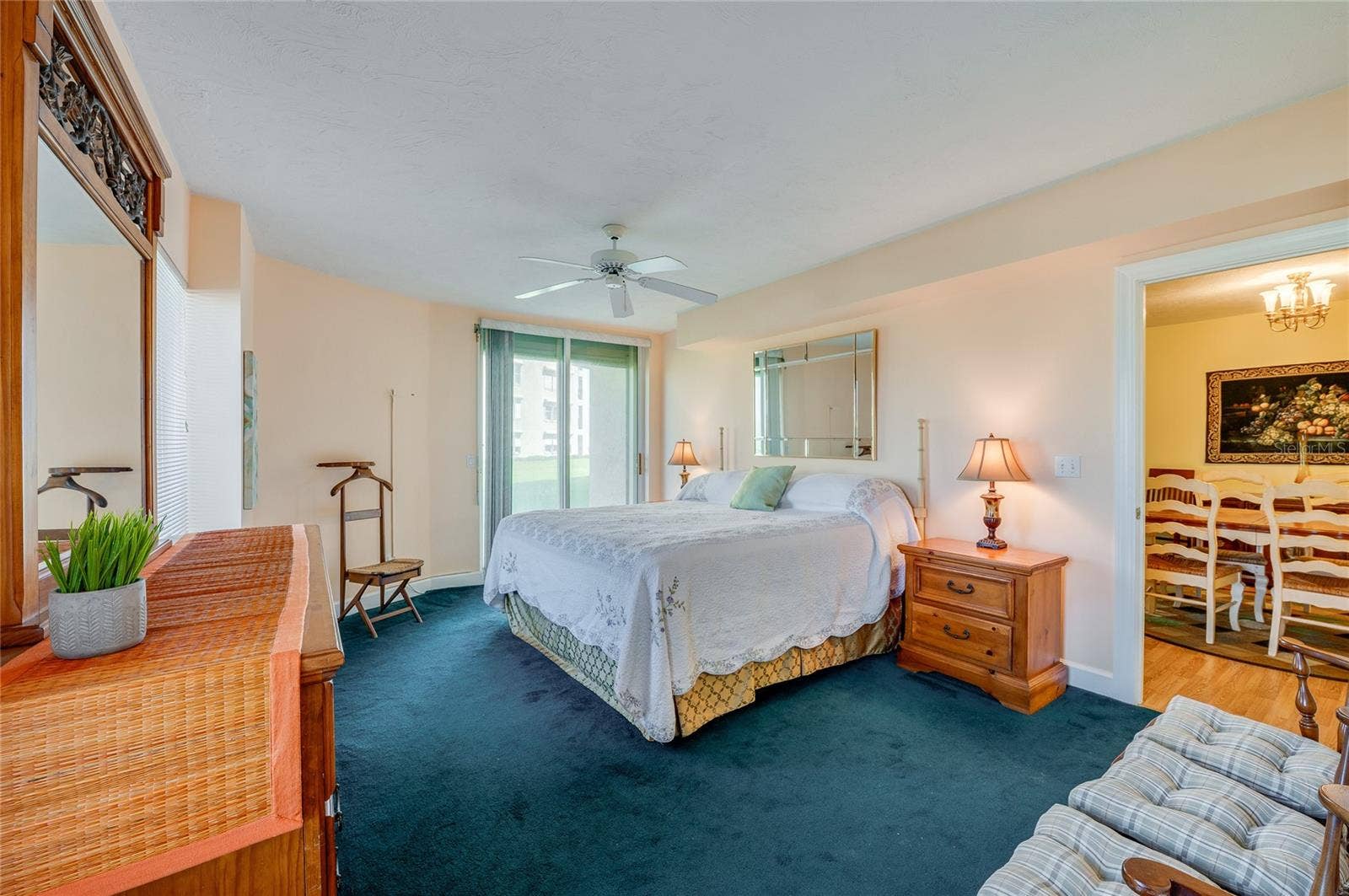 4575 S ATLANTIC AVENUE, #6101, Port Orange, FL 32127 Another angle showcases the rooms spacious layout and direct access to the outdoor patio, enhancing the airy, relaxing feel.