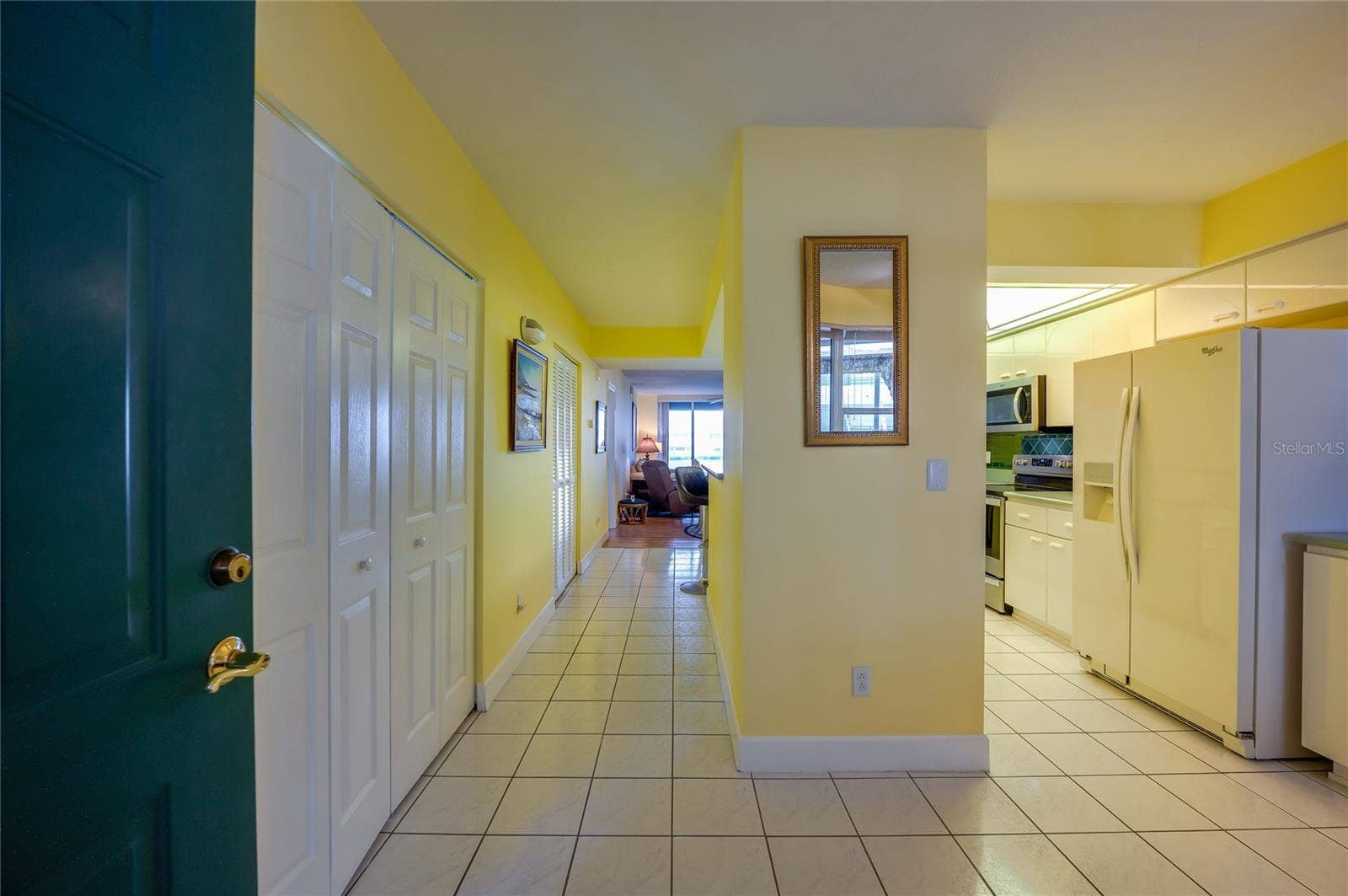 4575 S ATLANTIC AVENUE, #6101, Port Orange, FL 32127 A welcoming entry opens to a spacious hallway with tile flooring, leading into the main living areas and adjacent rooms.