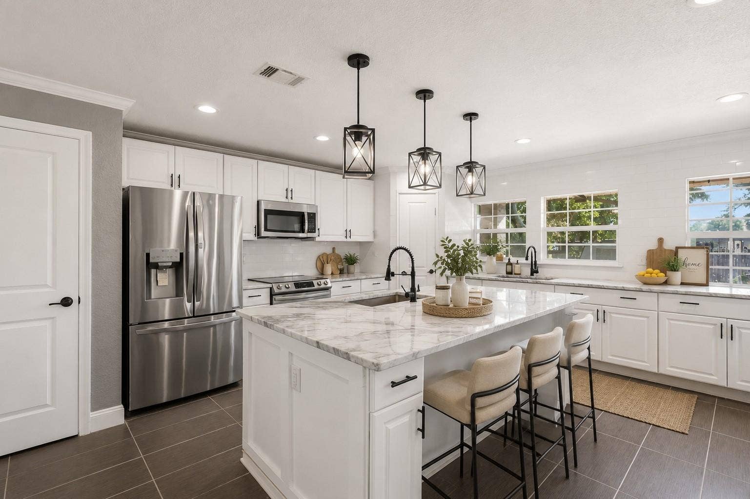 5414 RIVERSIDE DRIVE, Port Orange, FL 32127 Main House Updated Kitchen with granite countertops, oversized island with gray marble countertops, custom cabinetry, 2 pantries, and ALL brand-new stainless steel appliances