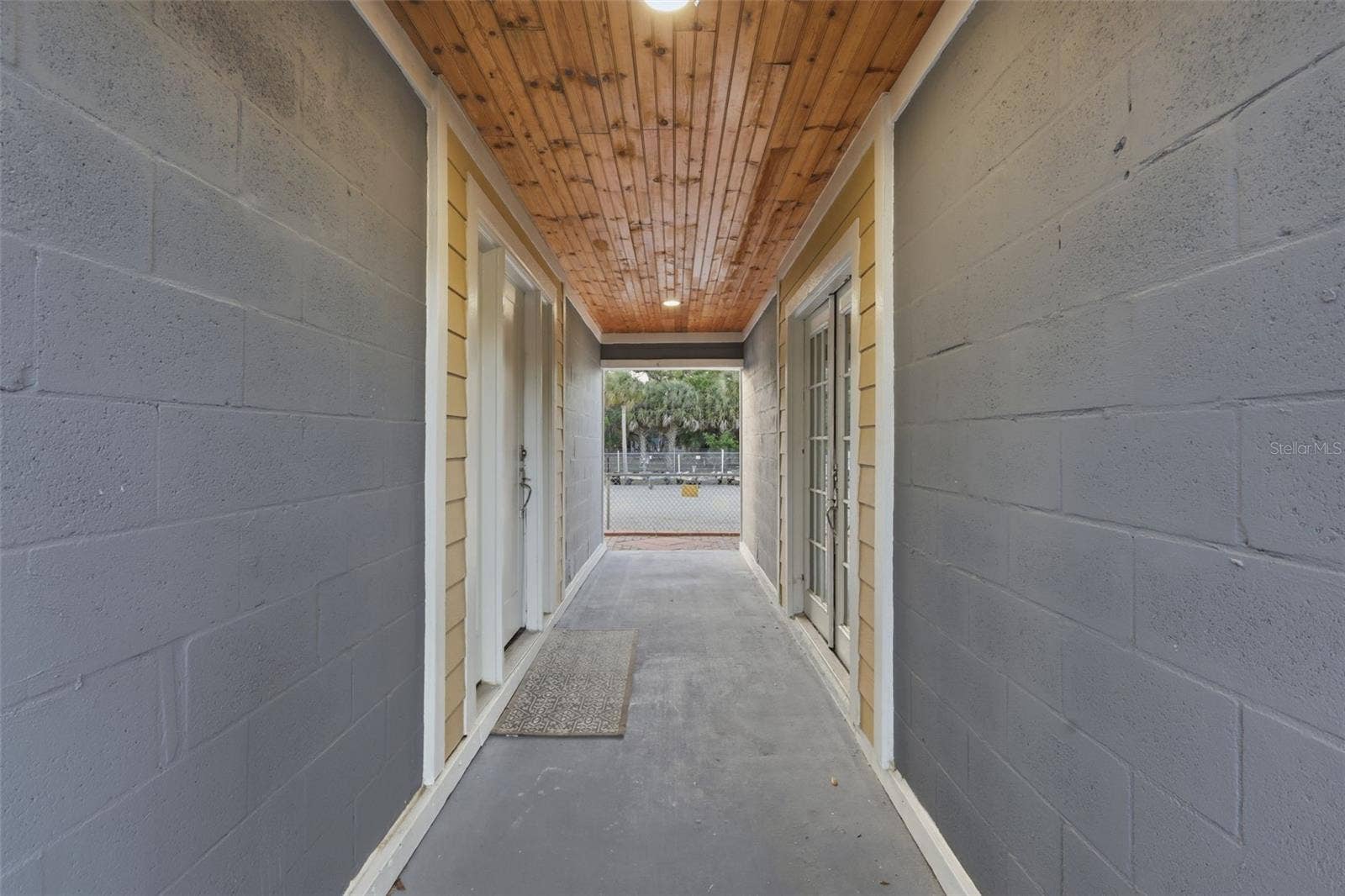 5414 RIVERSIDE DRIVE, Port Orange, FL 32127 Breezeway Dividing the studio/basement and the main house