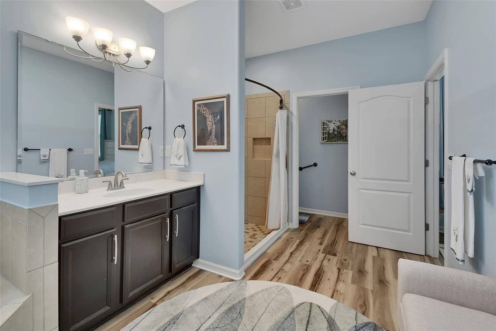 Privacy lavatory with linen closet.