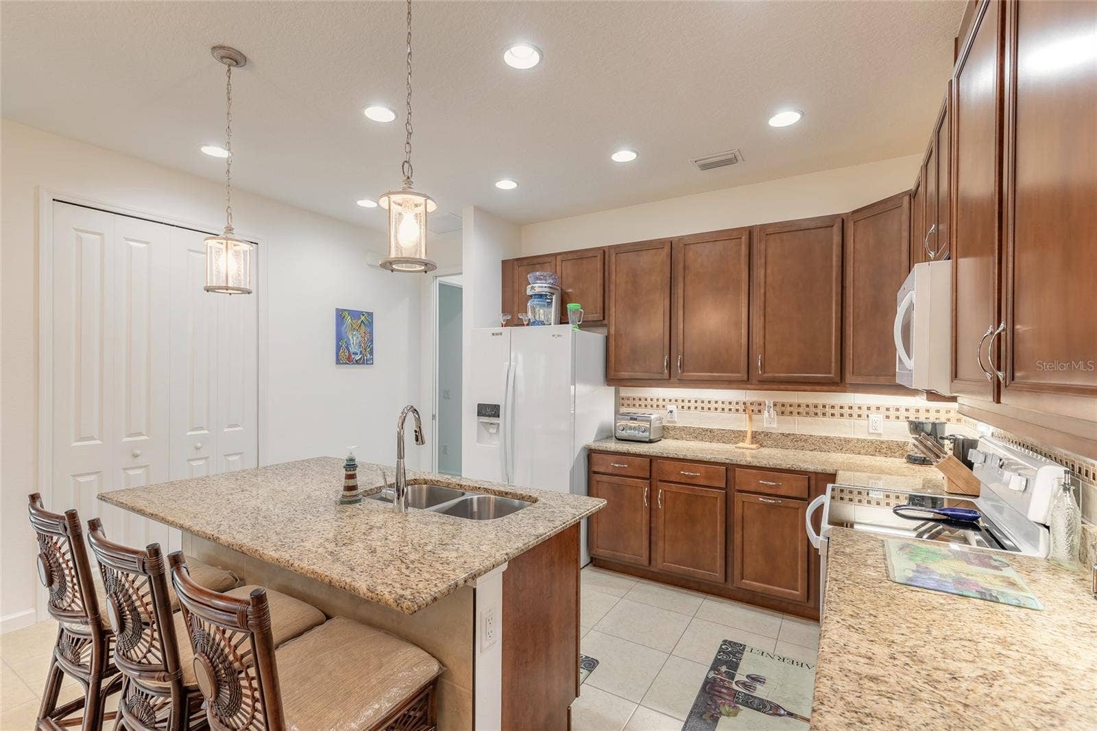 230 SAND BAR LANE, Daytona Beach, FL 32124 Kitchen island with bar seating & tile kick plate