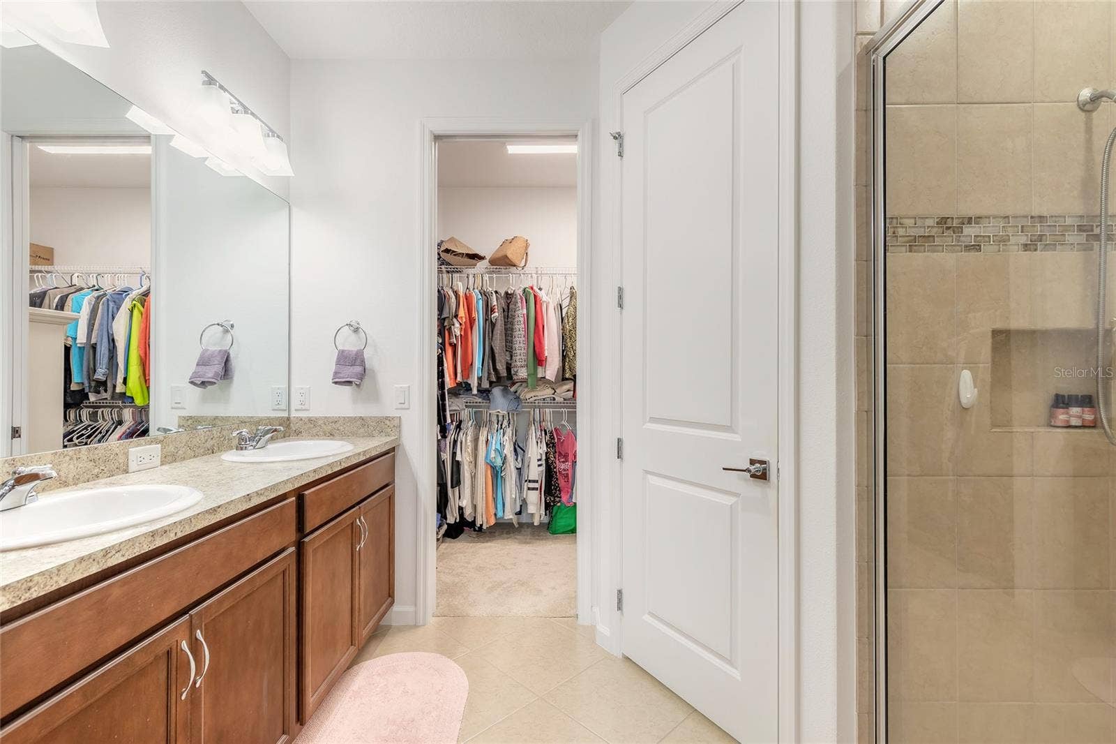 230 SAND BAR LANE, Daytona Beach, FL 32124 Primary ensuite bathroom with shower and large walk-in closet