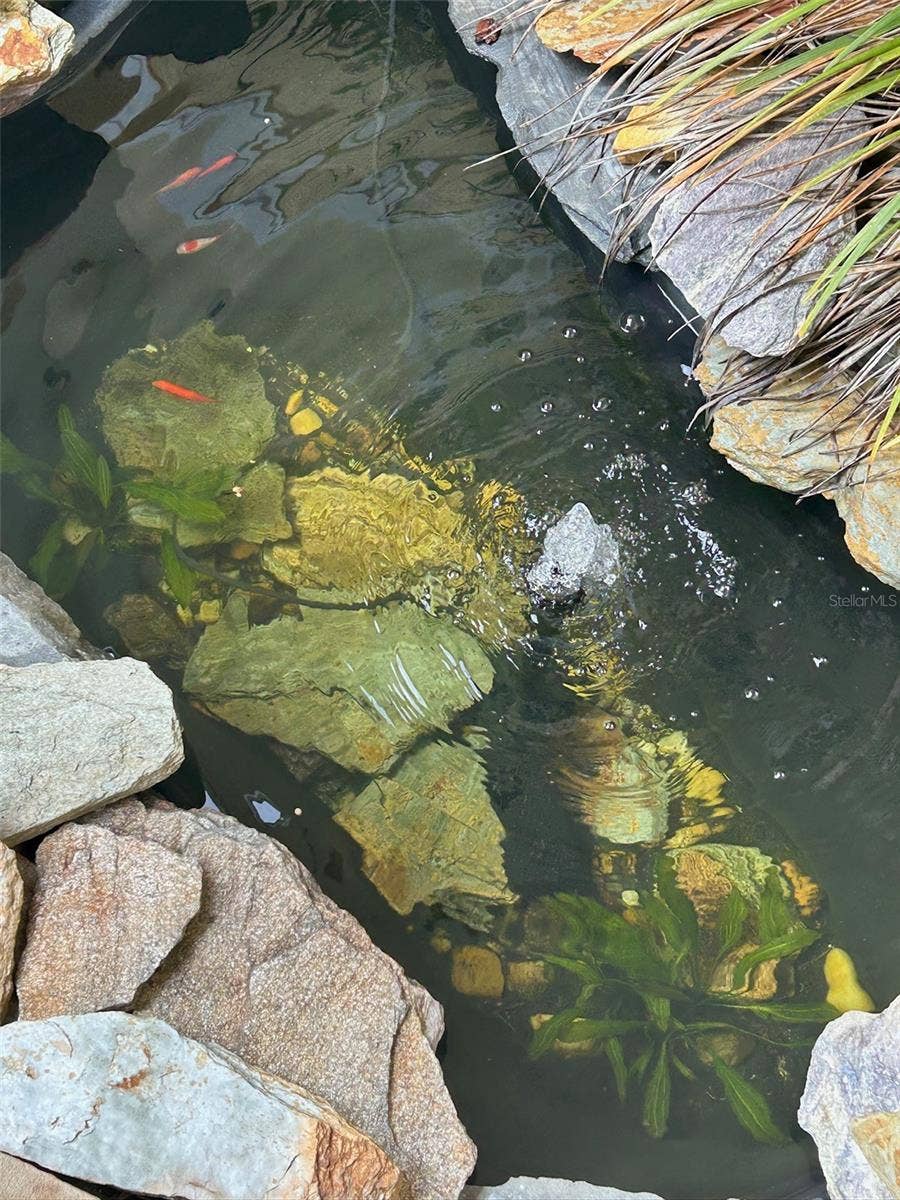 130 REEF ROAD, South Daytona, FL 32119 Pond in front Courtyard
