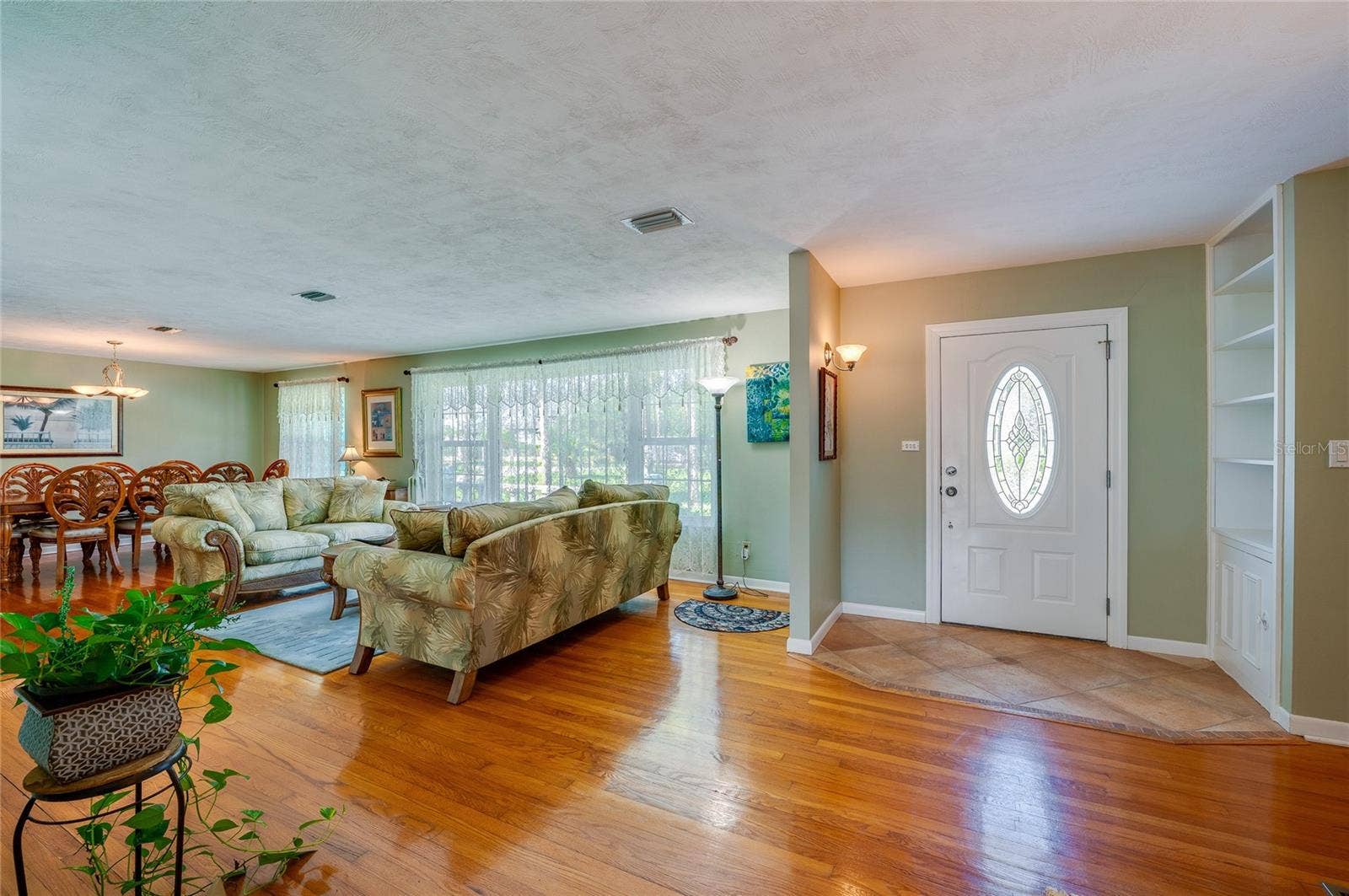 697 JOHN ANDERSON DRIVE, Ormond Beach, FL 32176 Entry showing living room and dining area