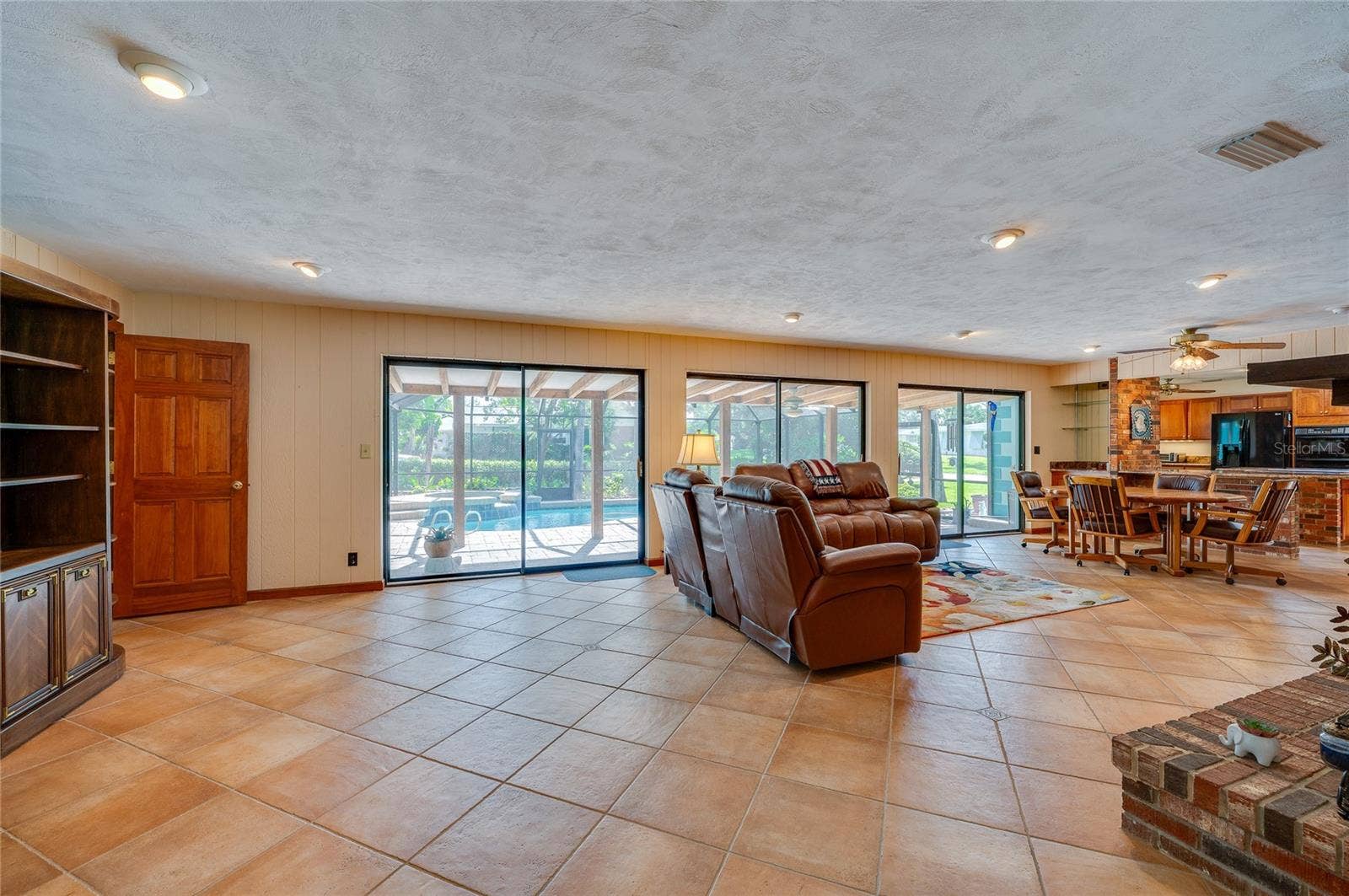 697 JOHN ANDERSON DRIVE, Ormond Beach, FL 32176 Family room with breakfast area and kitchen on right