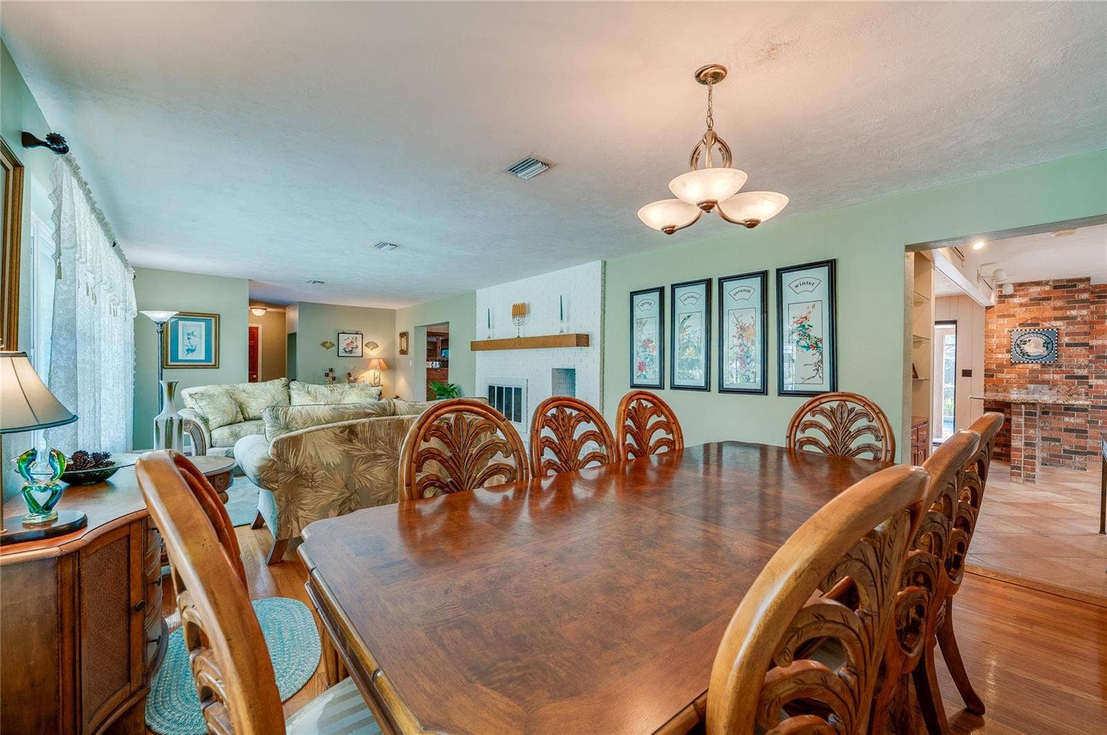 697 JOHN ANDERSON DRIVE, Ormond Beach, FL 32176 Living and dining showing kitchen to right