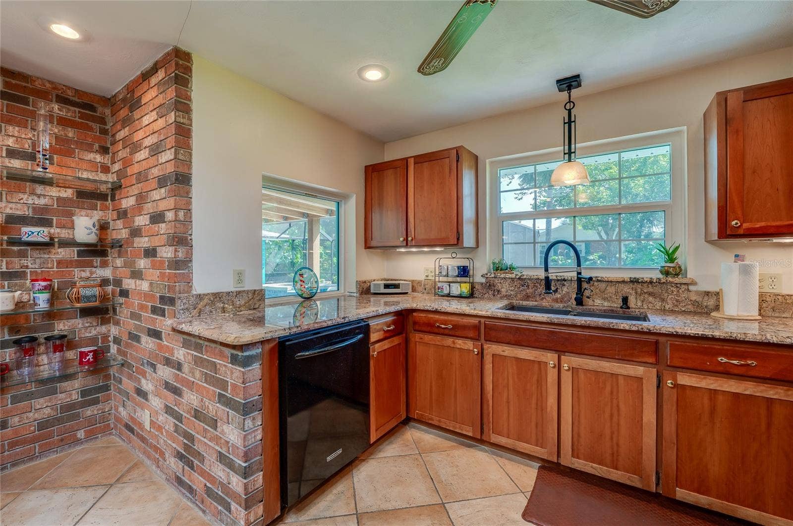 697 JOHN ANDERSON DRIVE, Ormond Beach, FL 32176 Kitchen with views to pool and backyard