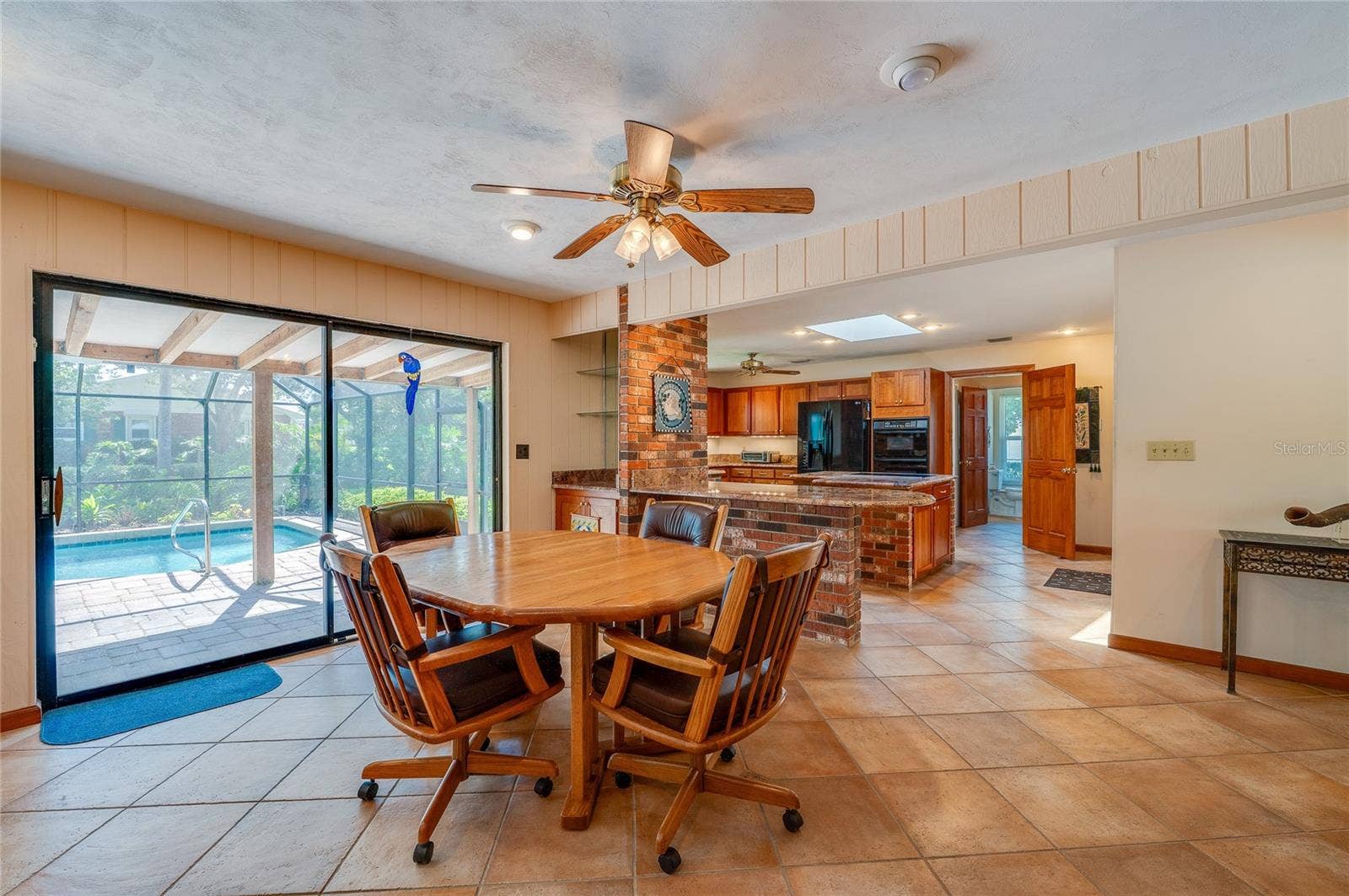 697 JOHN ANDERSON DRIVE, Ormond Beach, FL 32176 Breakfast area and kitchen