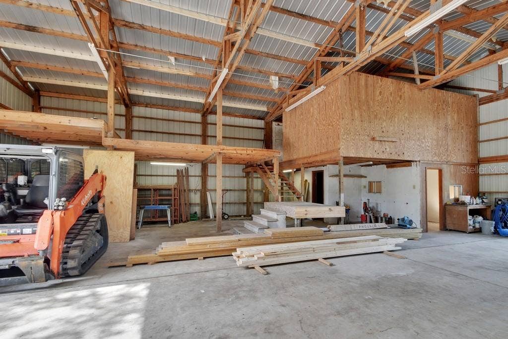 A stairway leads to 2 storage areas which has new plywood decking.