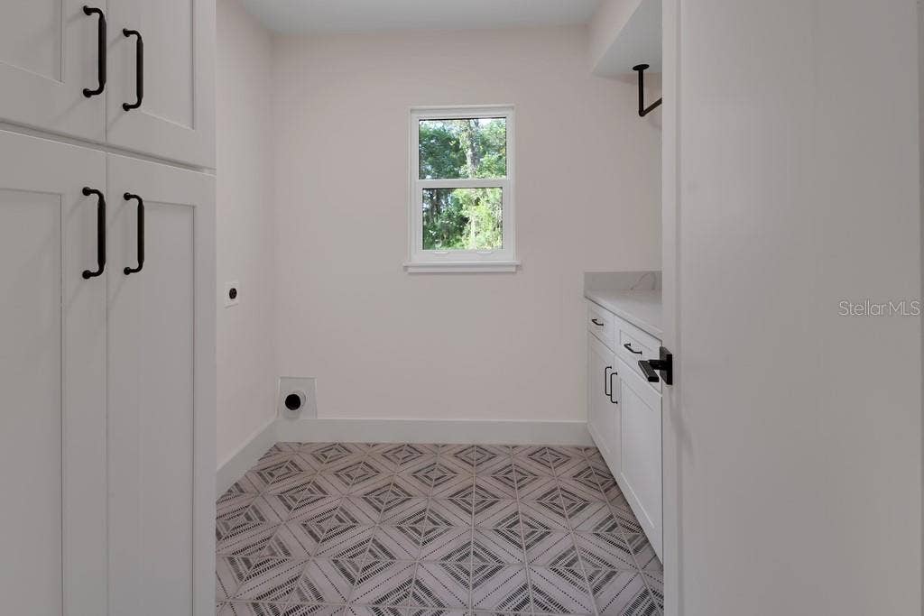 Super laundry room. Folding area and storage