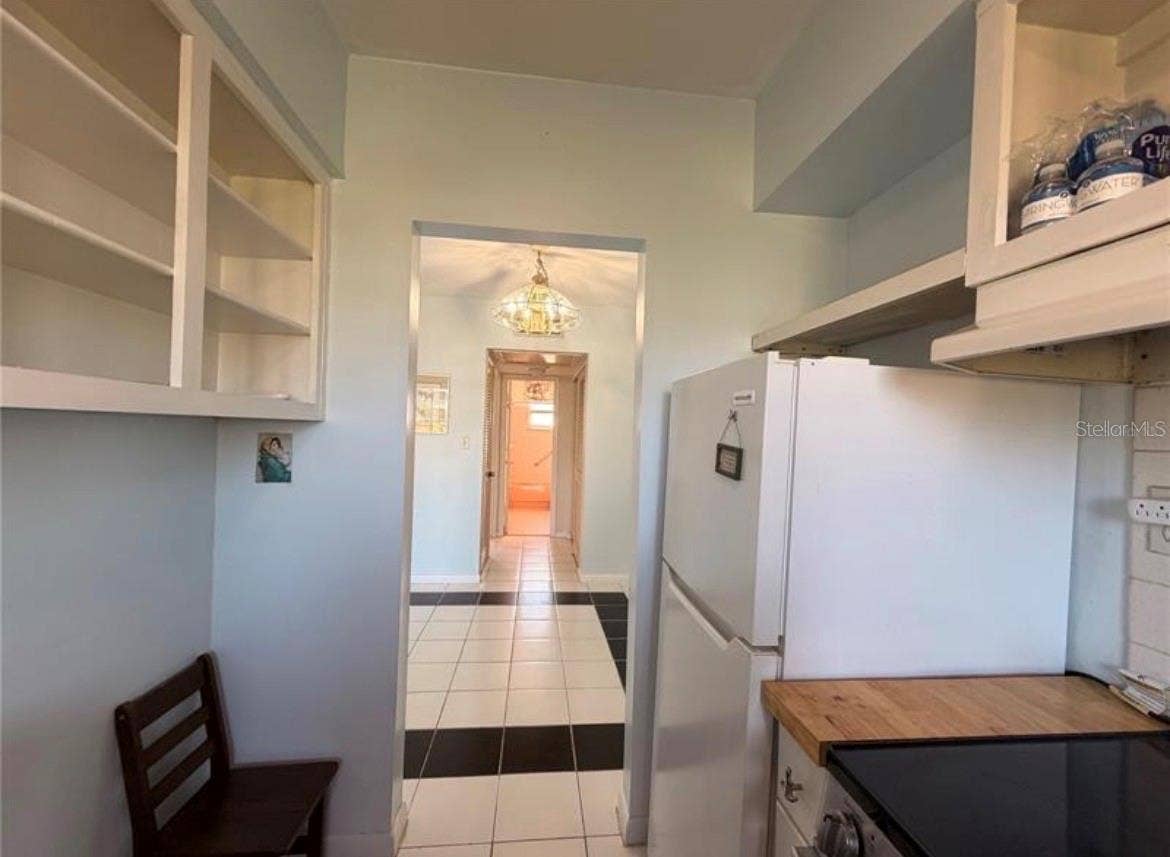3009 N HALIFAX AVENUE, #2, Daytona Beach, FL 32118 Kitchen 9X7 with open shelving