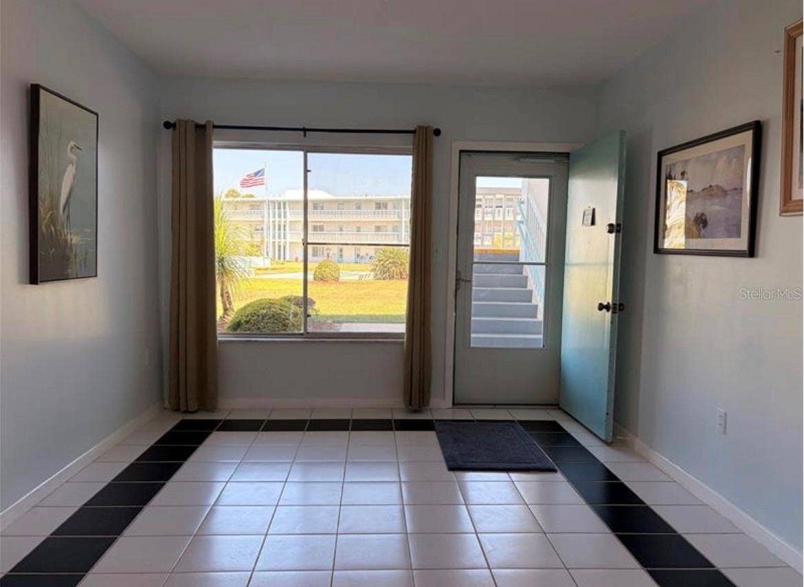 3009 N HALIFAX AVENUE, #2, Daytona Beach, FL 32118 Living room 18X11 with lots of natural light