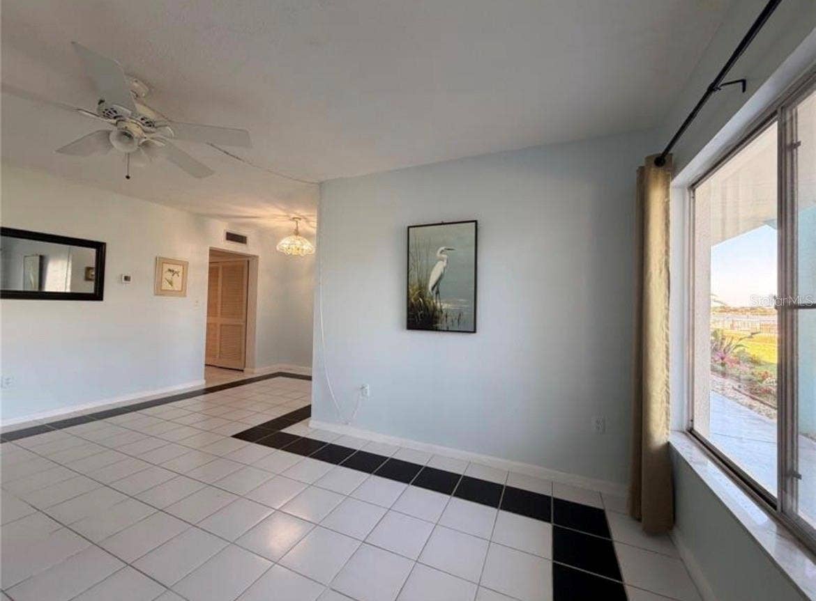 3009 N HALIFAX AVENUE, #2, Daytona Beach, FL 32118 Living room 18X11 with lots of natural light