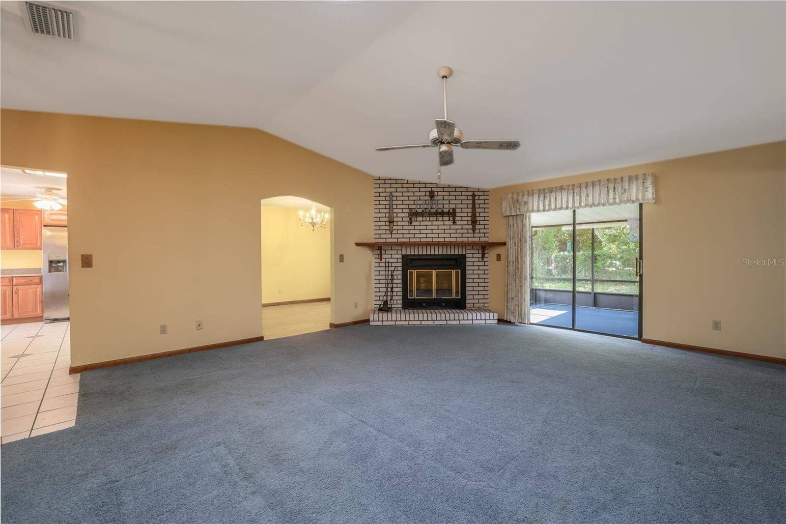 229 GEORGETOWNE BOULEVARD, Daytona Beach, FL 32119 Living Room to screened Lanai